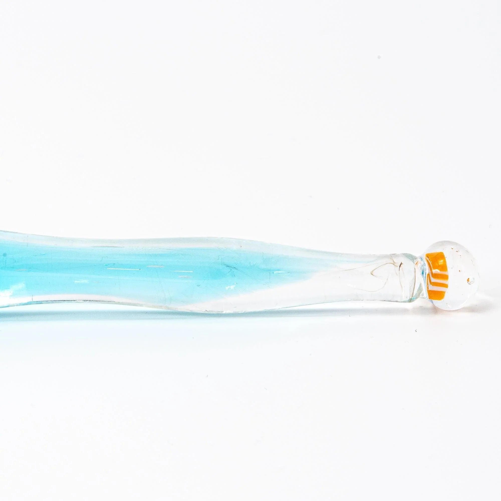 Japanese glass dip pen side angle view with clownfish and coral reef in gray-tinted aquarium barrel section