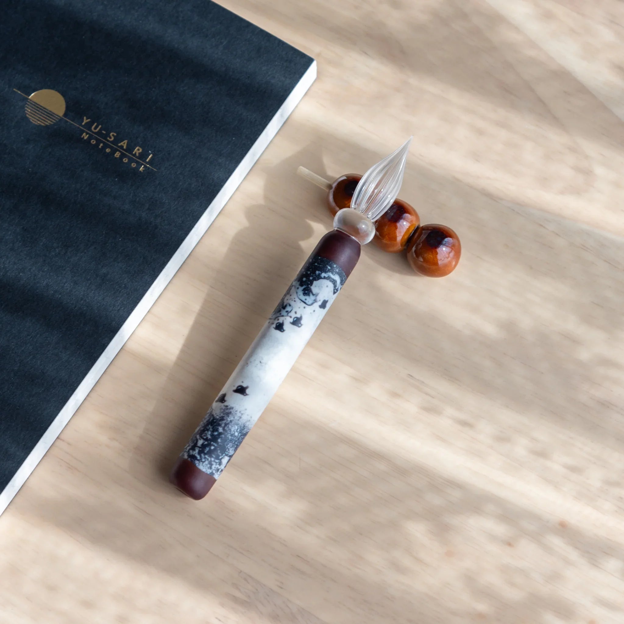 Burgundy and white dango pen rest showing three separate colorway combinations arranged side by side for comparison