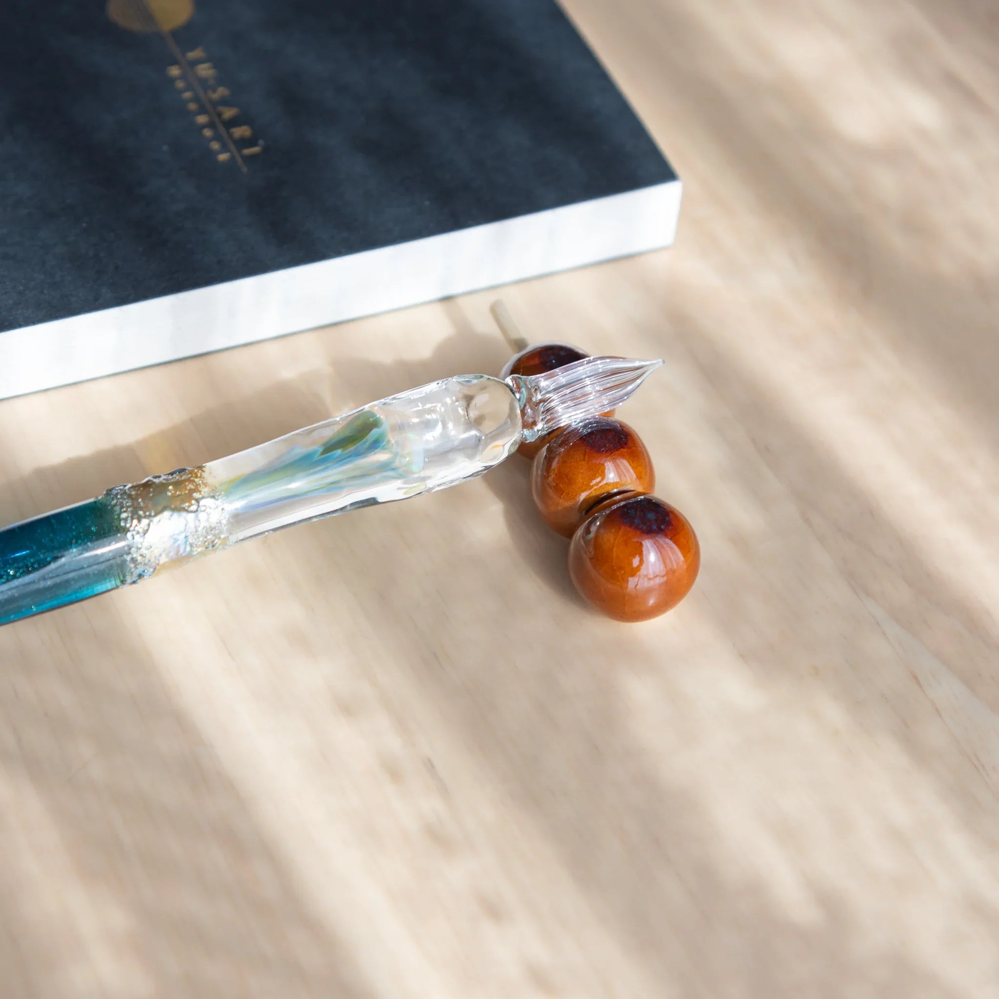 Warm orange dango handcrafted pen rest with three-sphere vertical design