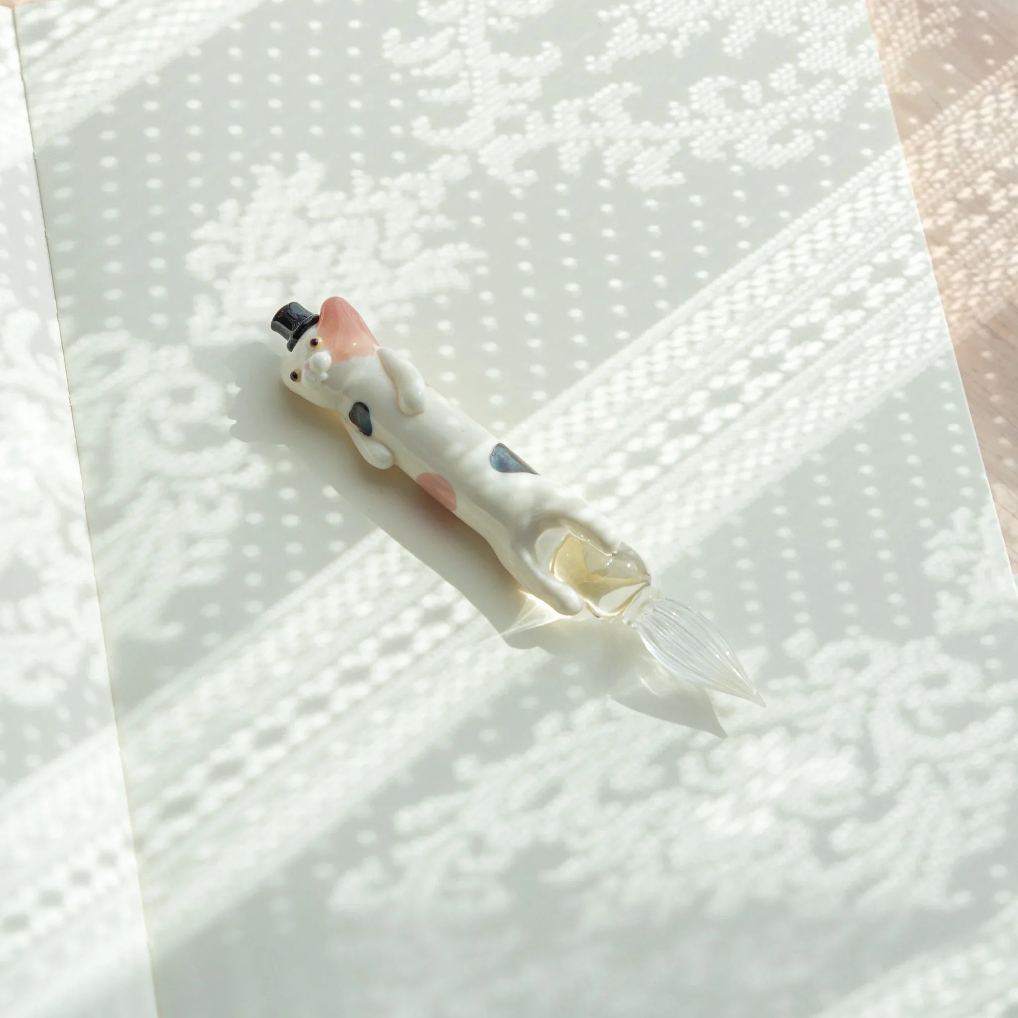 Spotted cat glass dip pen showcasing talented resin work with hand-blown glass components with unique design