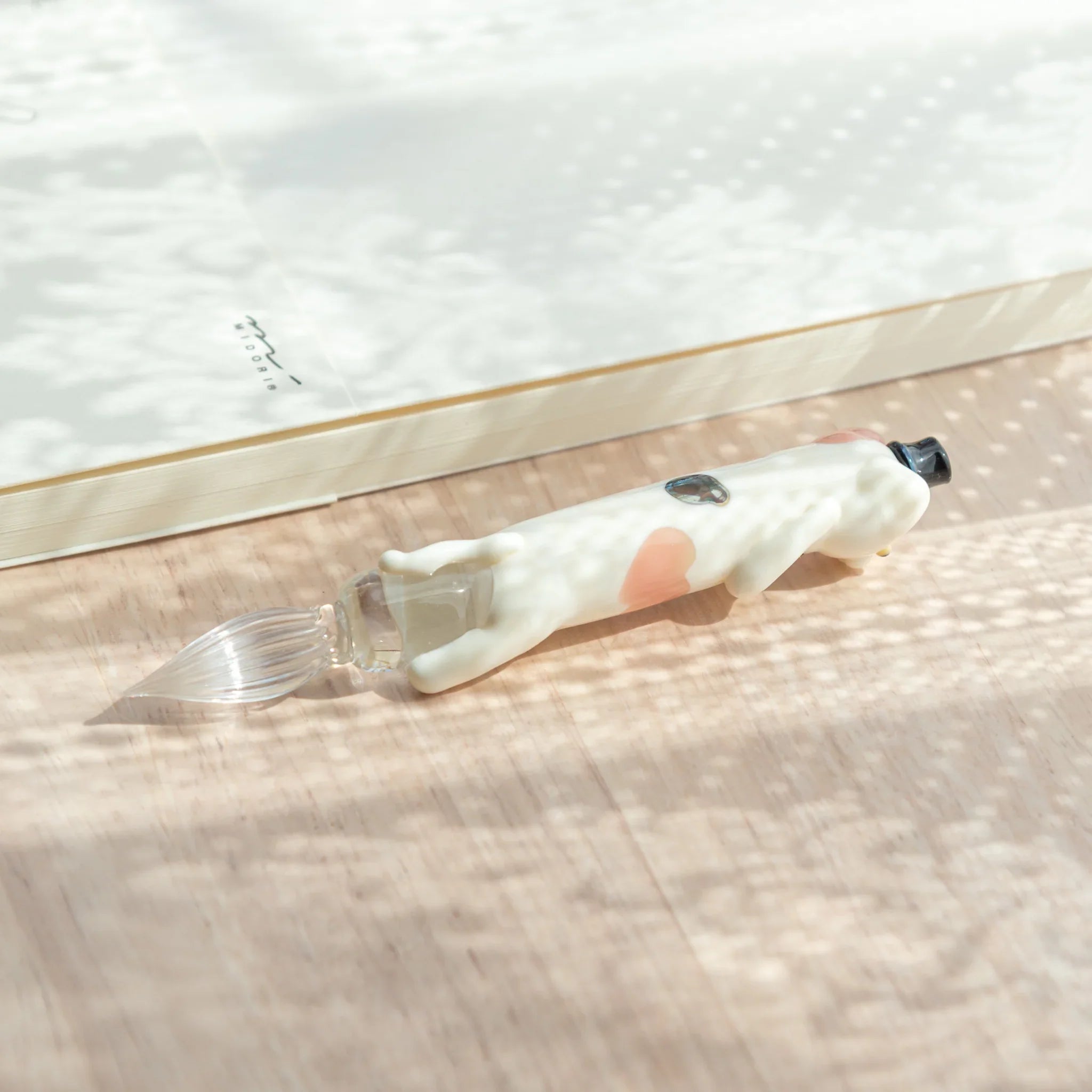 cat glass dip pen with detailed spotted feline design and decorative colored glass barrel holder