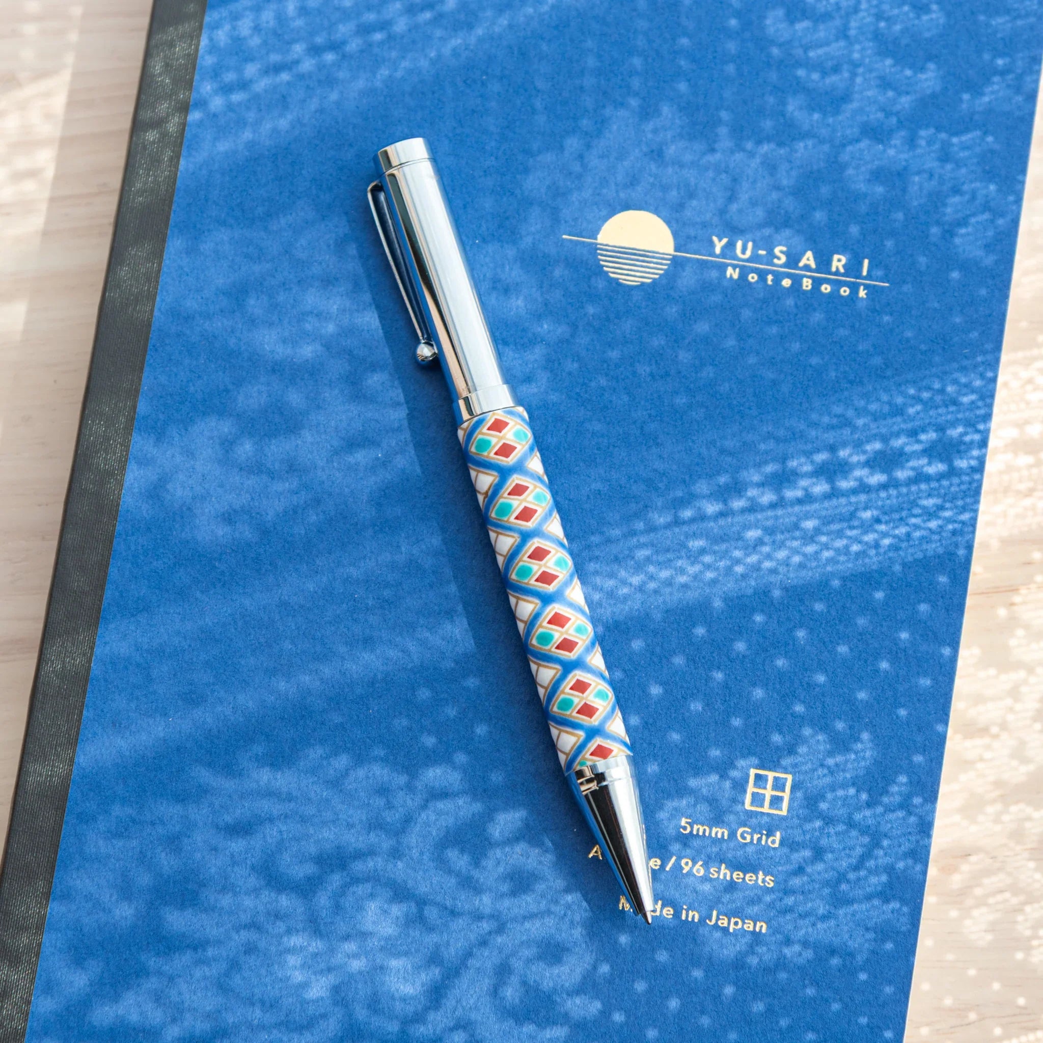 Luxury Kutani ceramic ballpoint pen showcasing diamond geometric pattern in vibrant colors featuring traditional