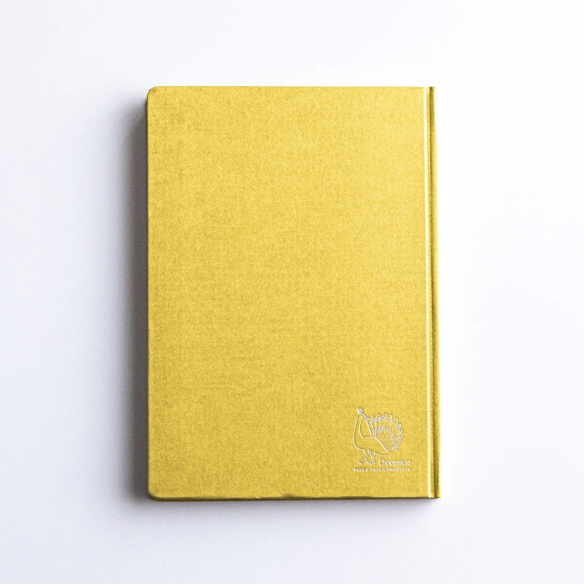 Minimalist top view of Dressco Bank Ledger Paper Japanese Notebook in Gold.