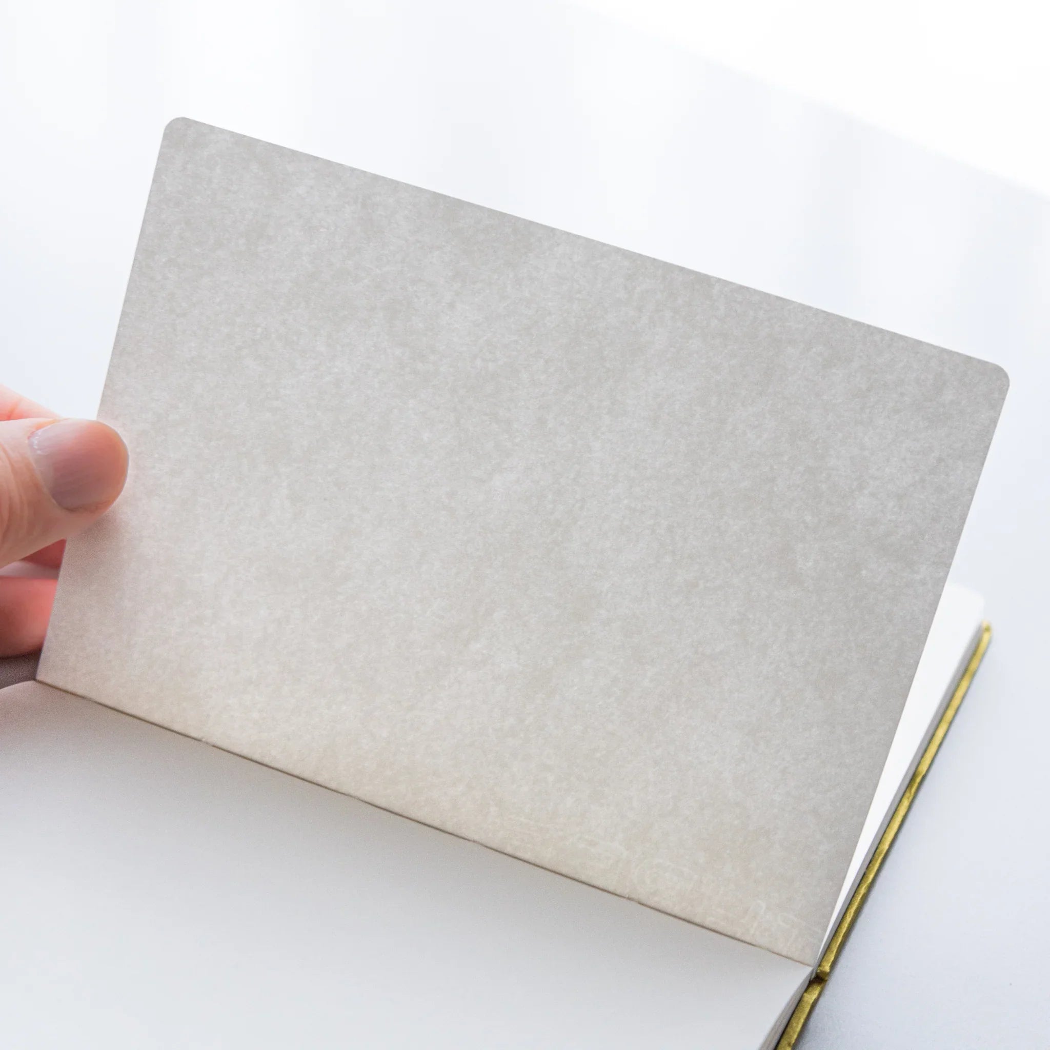 Dressco Bank Ledger Paper A6 notebook flat overhead view showing the cover design and compact A6 dimensions