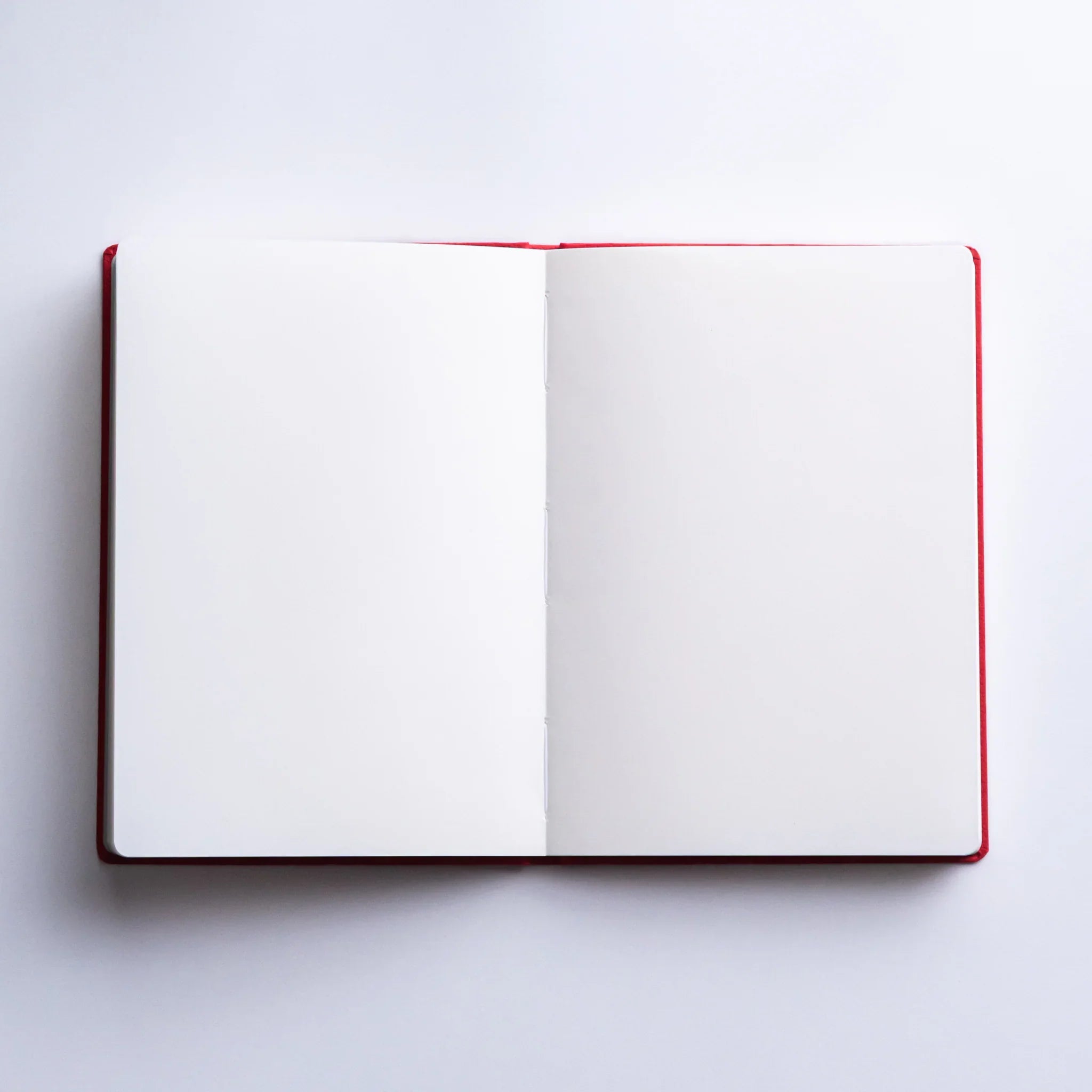 Dressco Bank Ledger Paper A6 notebook side profile showing book depth and the sewn spine binding construction