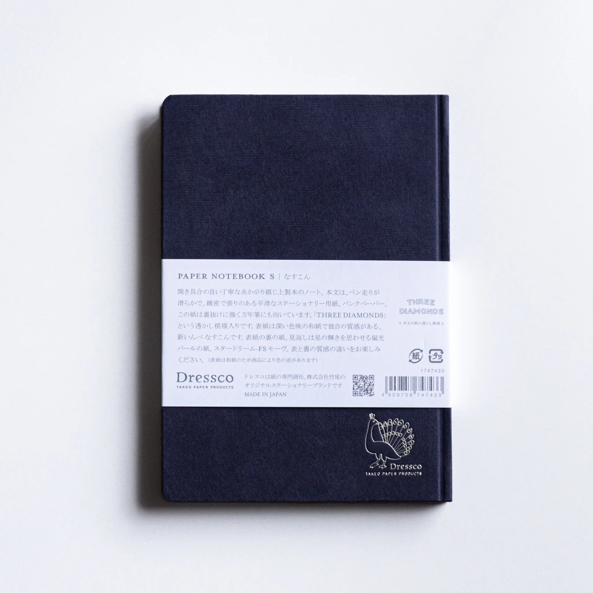 Overhead shot of Dressco Bank Ledger Paper A6 notebook showing cover design and compact A6 format proportions