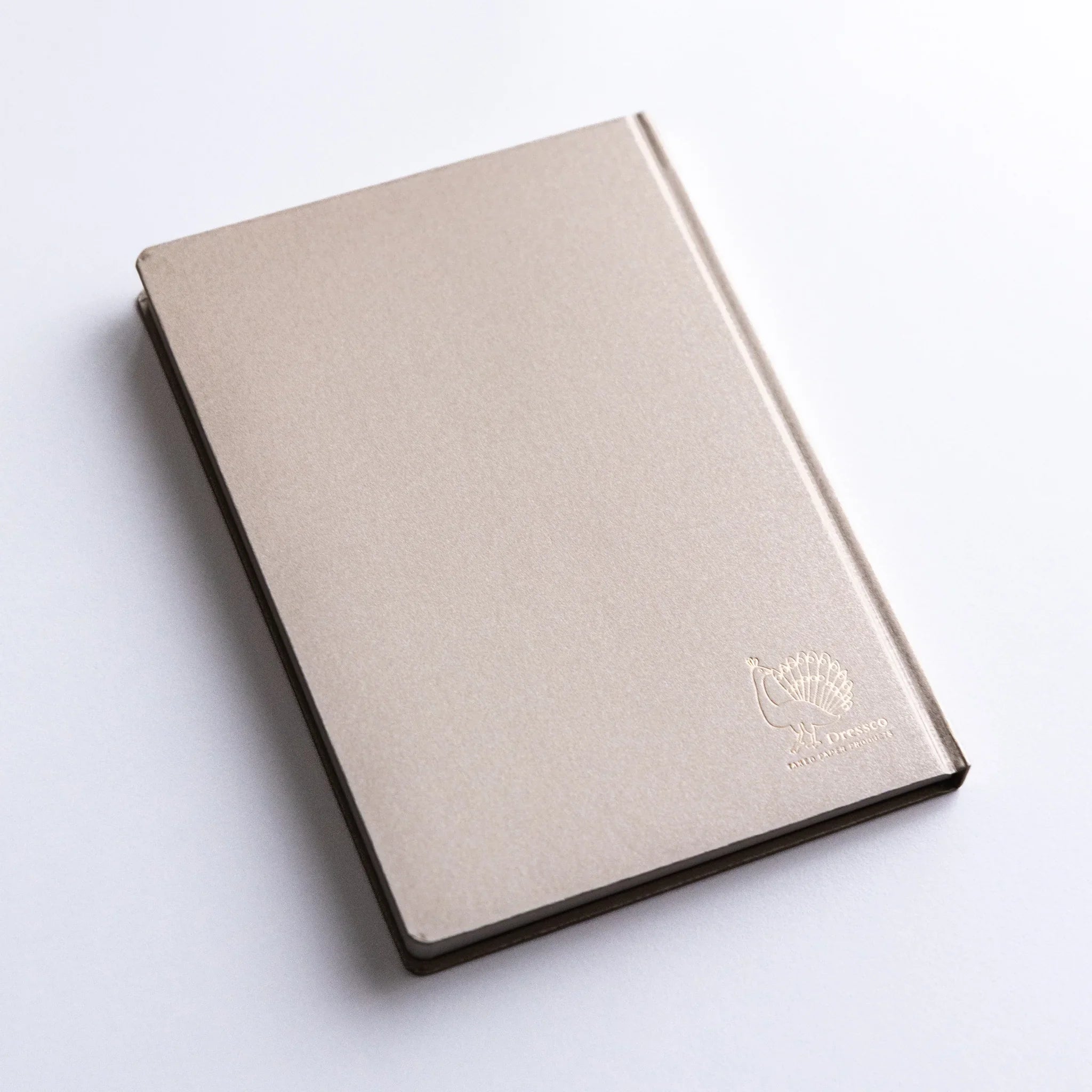 Overhead view of Dressco Bank Ledger Paper A6 notebook displaying full cover design and compact A6 size proportions