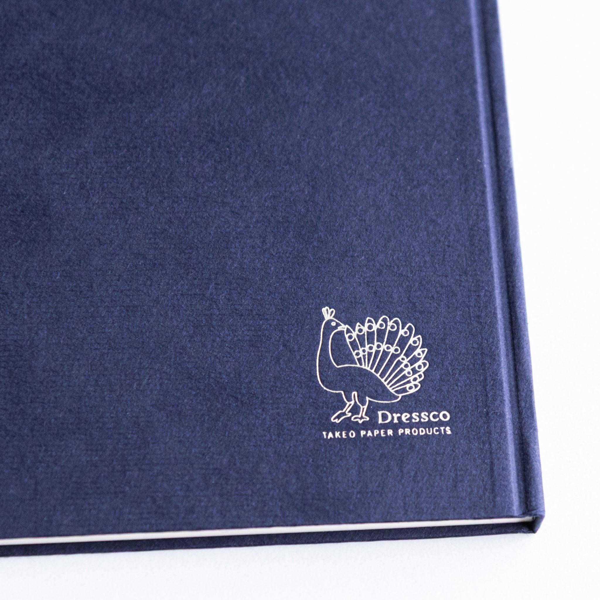 Close-up of embossed Dressco logo on Nasukon Japanese Notebook cover.