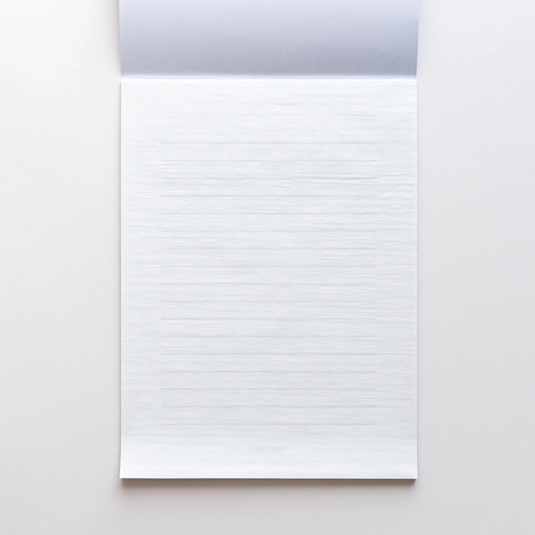 Open Dressco writing pad showing thin onion skin sheets and interior blank pages for writing and personal correspondence use