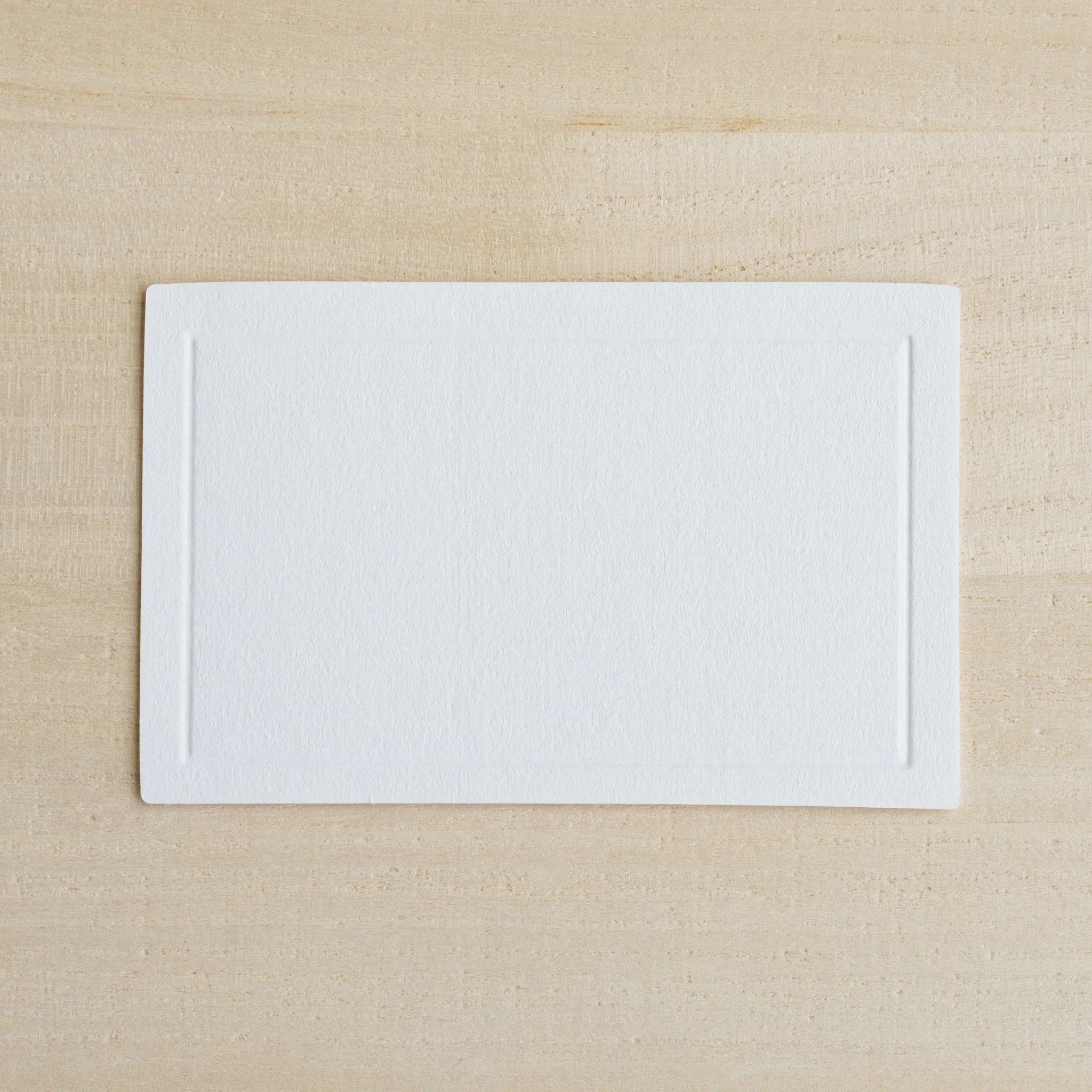 Overhead collection view of three-card Dressco Conqueror message card set for personal correspondence and gifting