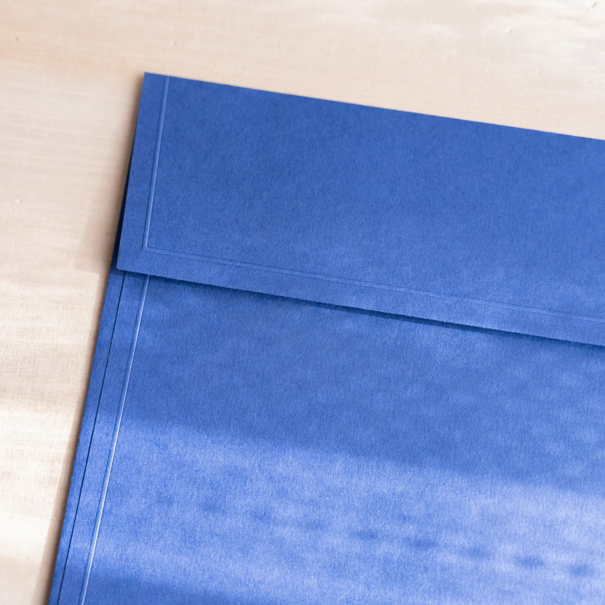 Dressco ivory large embossed envelope image ninety-five, overhead flat composition, with embossed surface, set of three