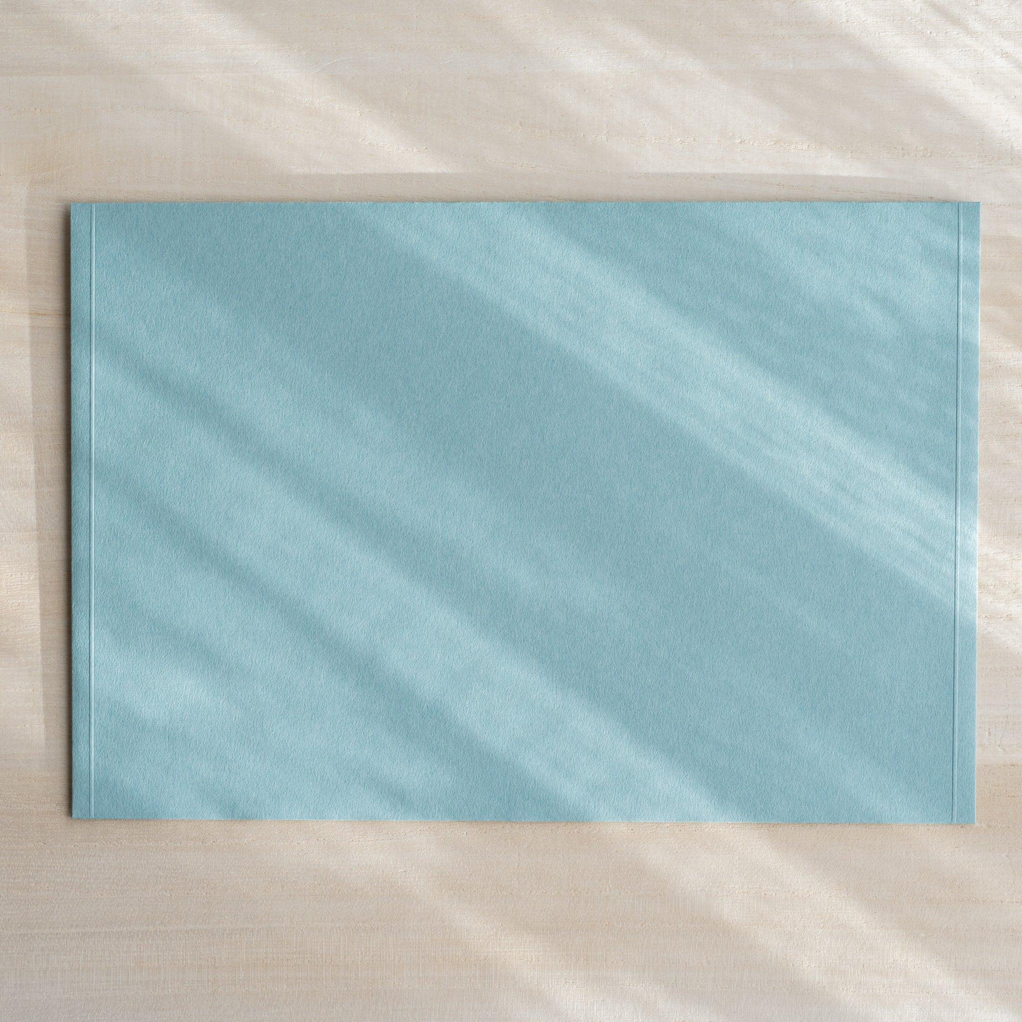 Dressco ivory large embossed envelope image thirteen, left angled side view, with embossed finish, set of three