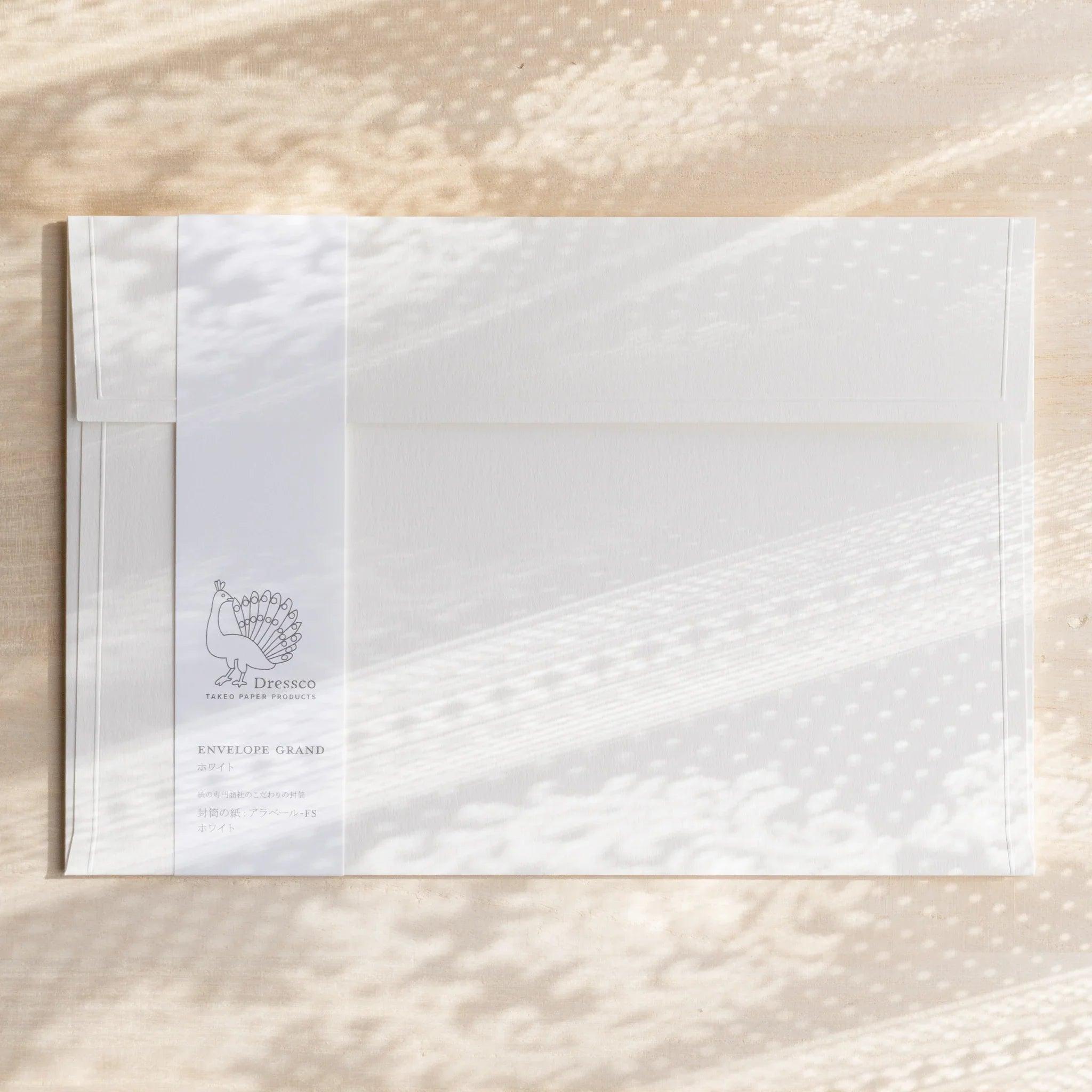 Dressco ivory large embossed envelope image fifteen, overhead flat composition, with embossed surface, set of three
