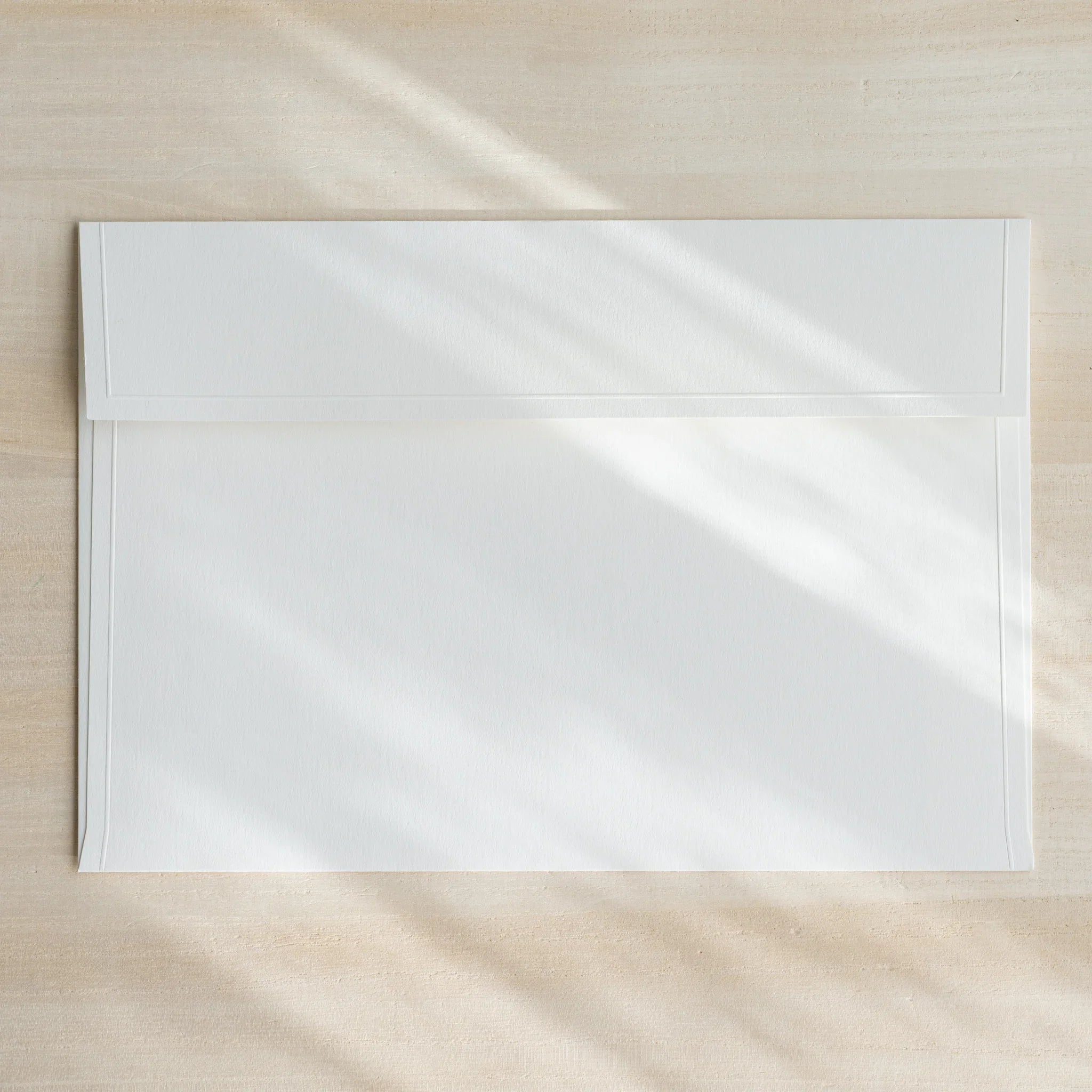 Dressco ivory large embossed envelope image nineteen, fanned display layout, with embossed paper, set of three