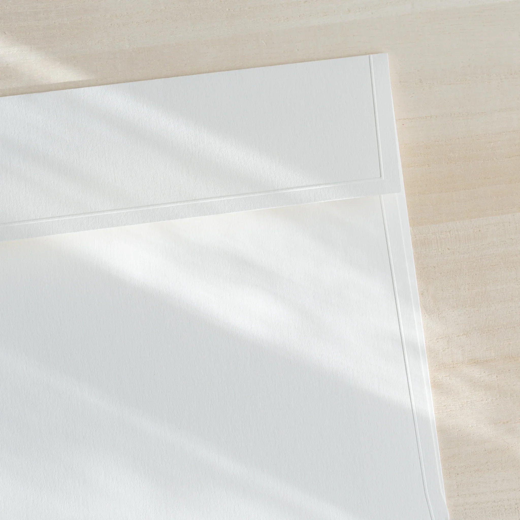 Dressco ivory large embossed envelope image twenty-one, front view showing sealed flap, with raised embossing, set of three