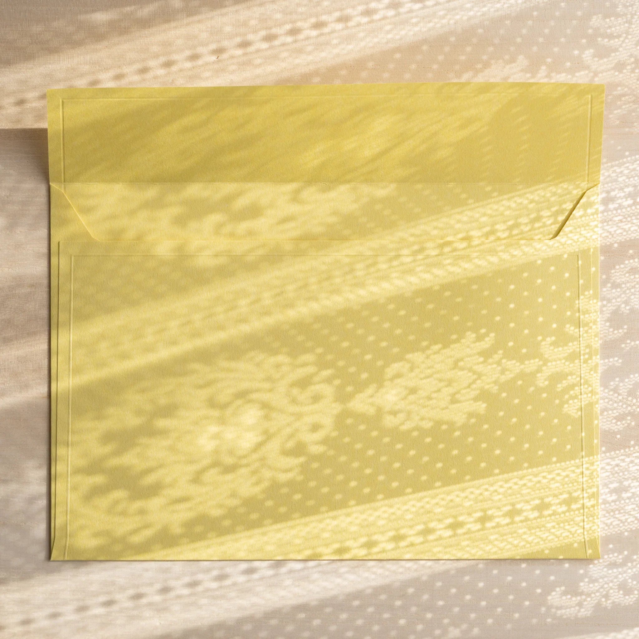 Dressco ivory large embossed envelope image thirty-four, right angled side view, with embossing detail, set of three