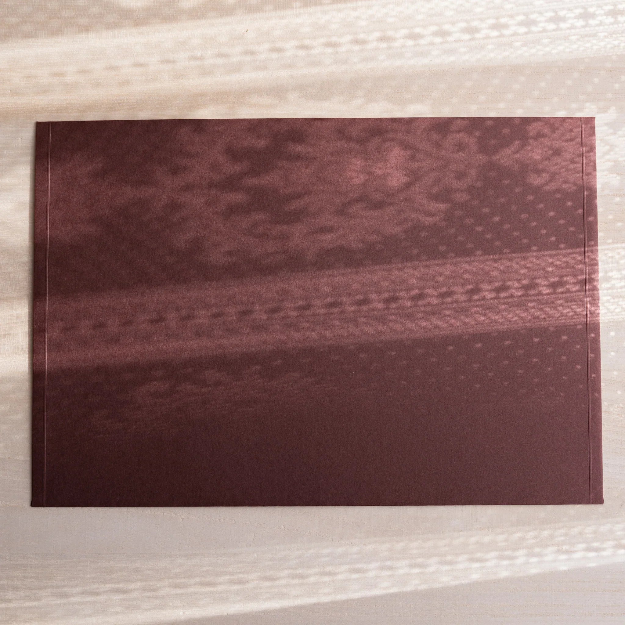 Dressco ivory large embossed envelope image seventy-five, overhead flat composition, with embossed surface, set of three