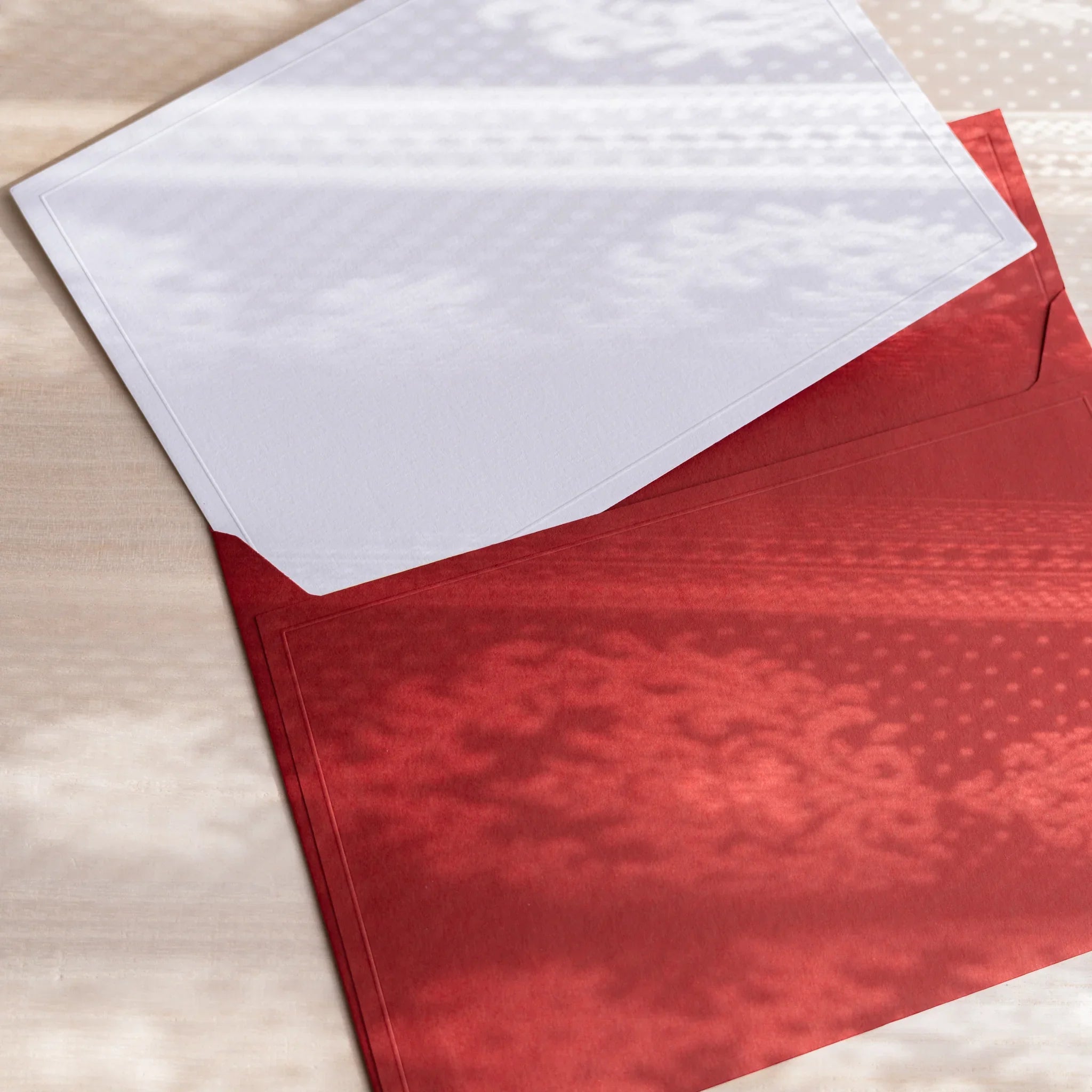 Dressco ivory large embossed envelope image eighty-five, overhead flat composition, with embossed surface, set of three