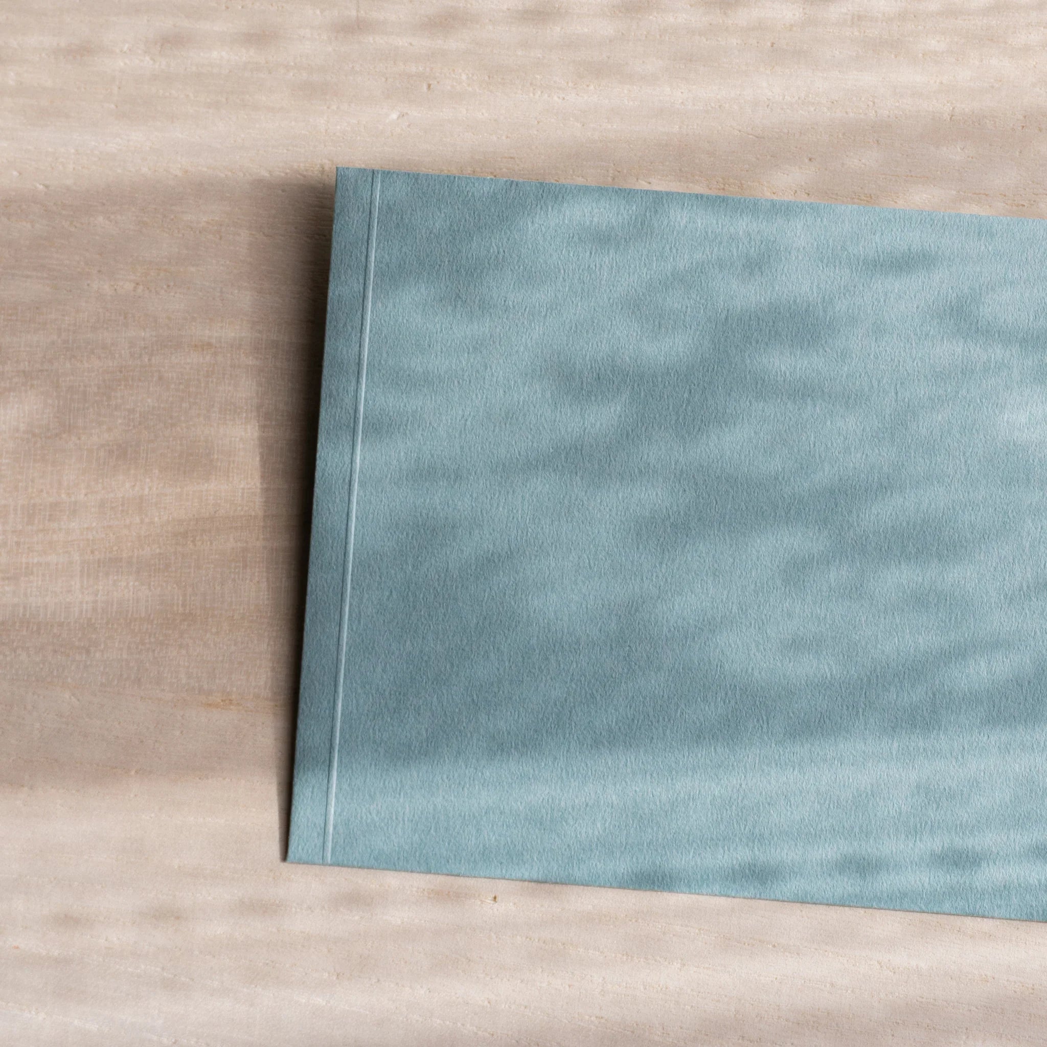 Dressco ivory medium embossed envelope image twelve, back view showing flap closure, with embossed pattern, set of three