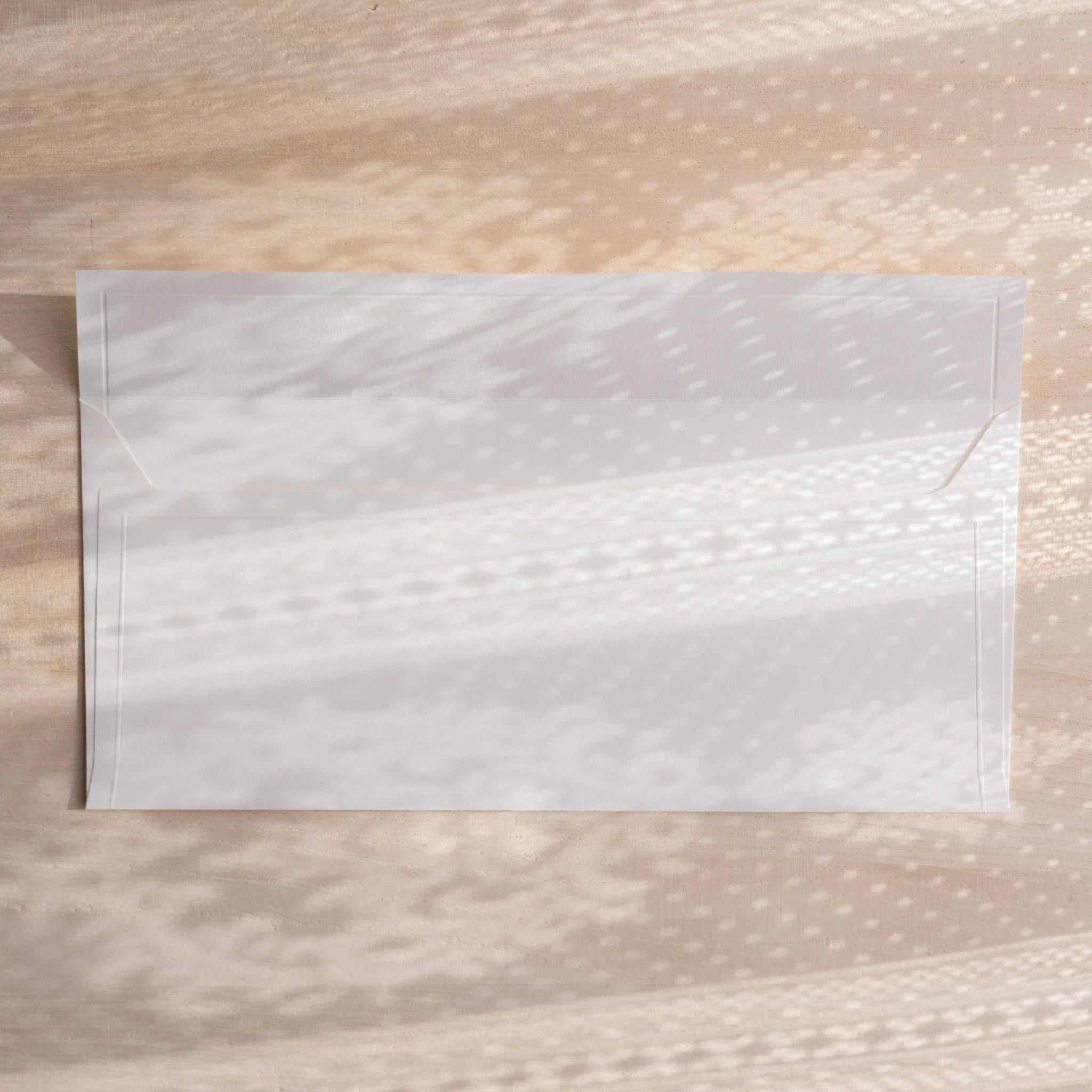 Dressco ivory medium embossed envelope image nineteen, fanned display layout, with embossed paper, set of three