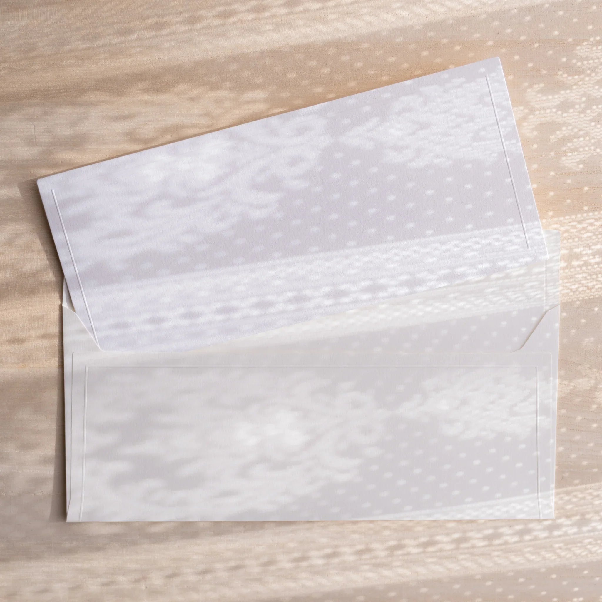 Dressco ivory medium embossed envelope image twenty, stacked arrangement view, with embossing elegance, set of three