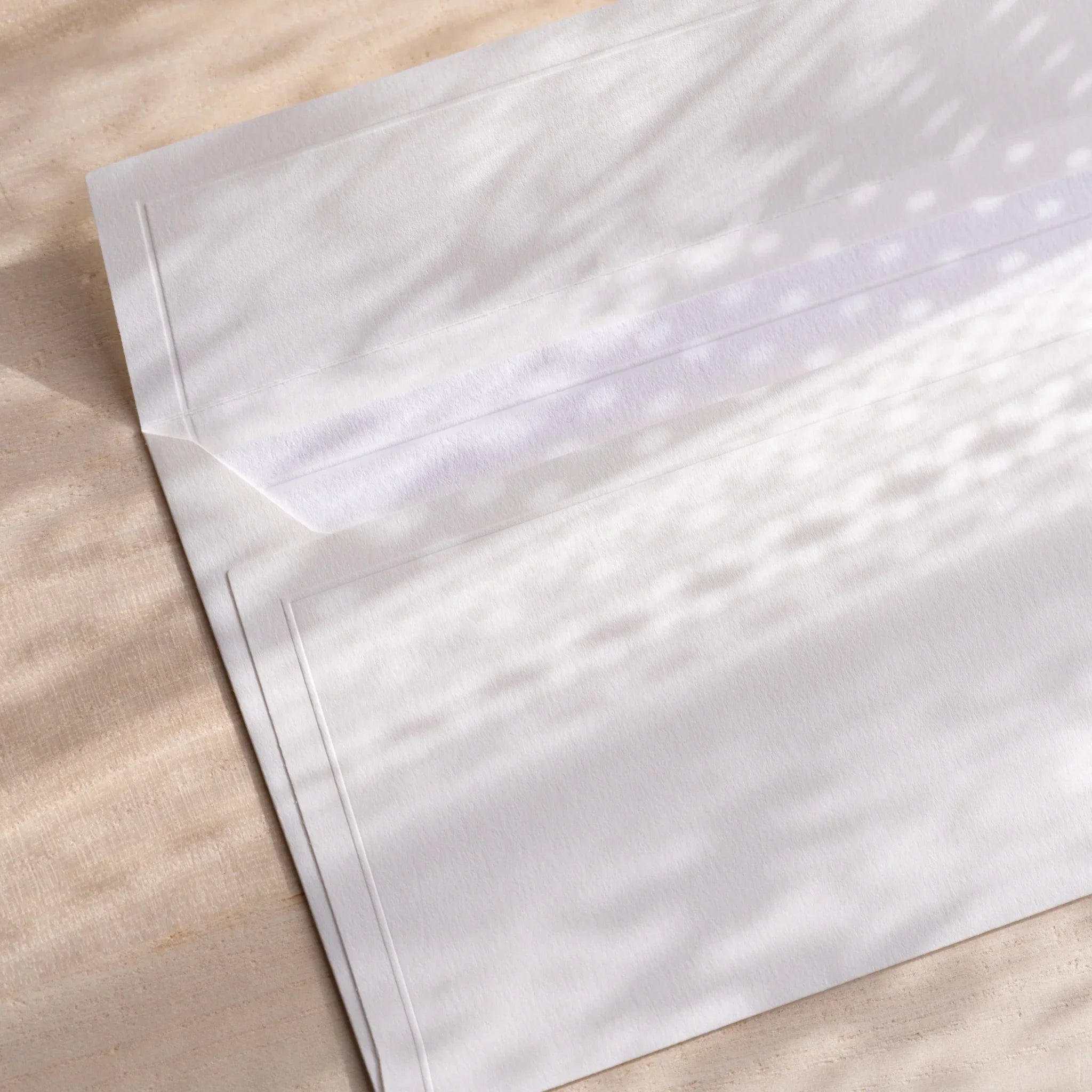 Dressco ivory medium embossed envelope image twenty-two, back view showing flap closure, with embossed pattern, set of three