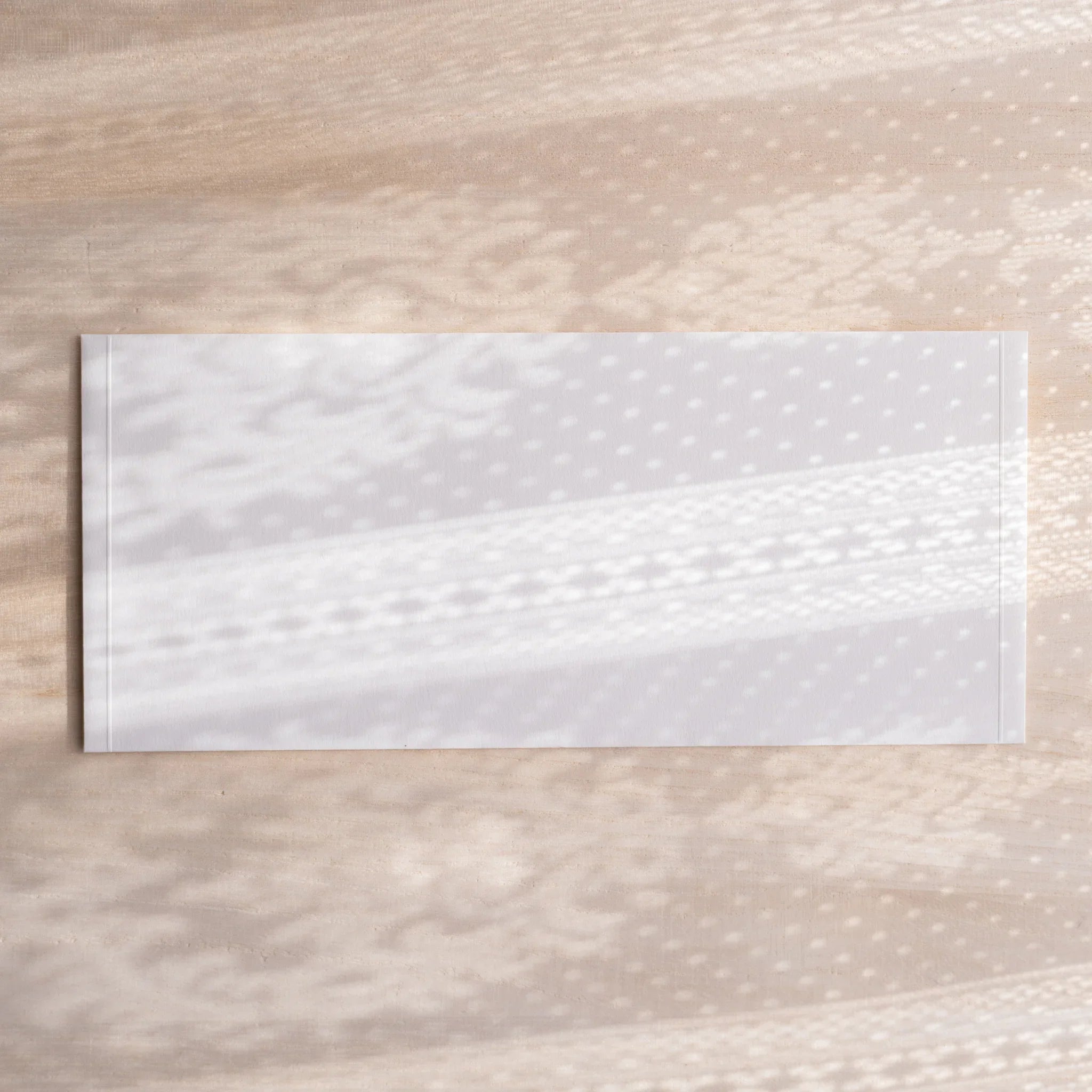 Dressco ivory medium embossed envelope image twenty-three, left angled side view, with embossed finish, set of three