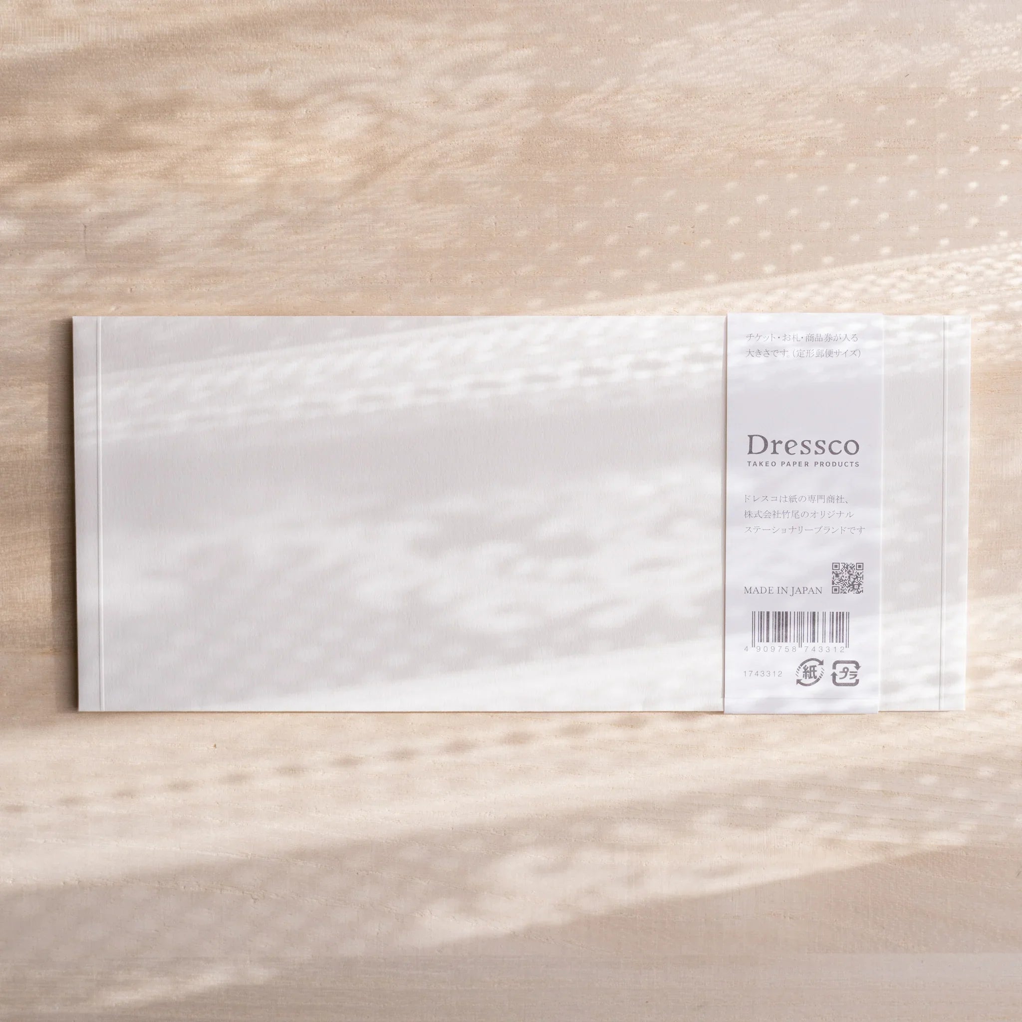 Dressco ivory medium embossed envelope image twenty-five, overhead flat composition, with embossed surface, set of three