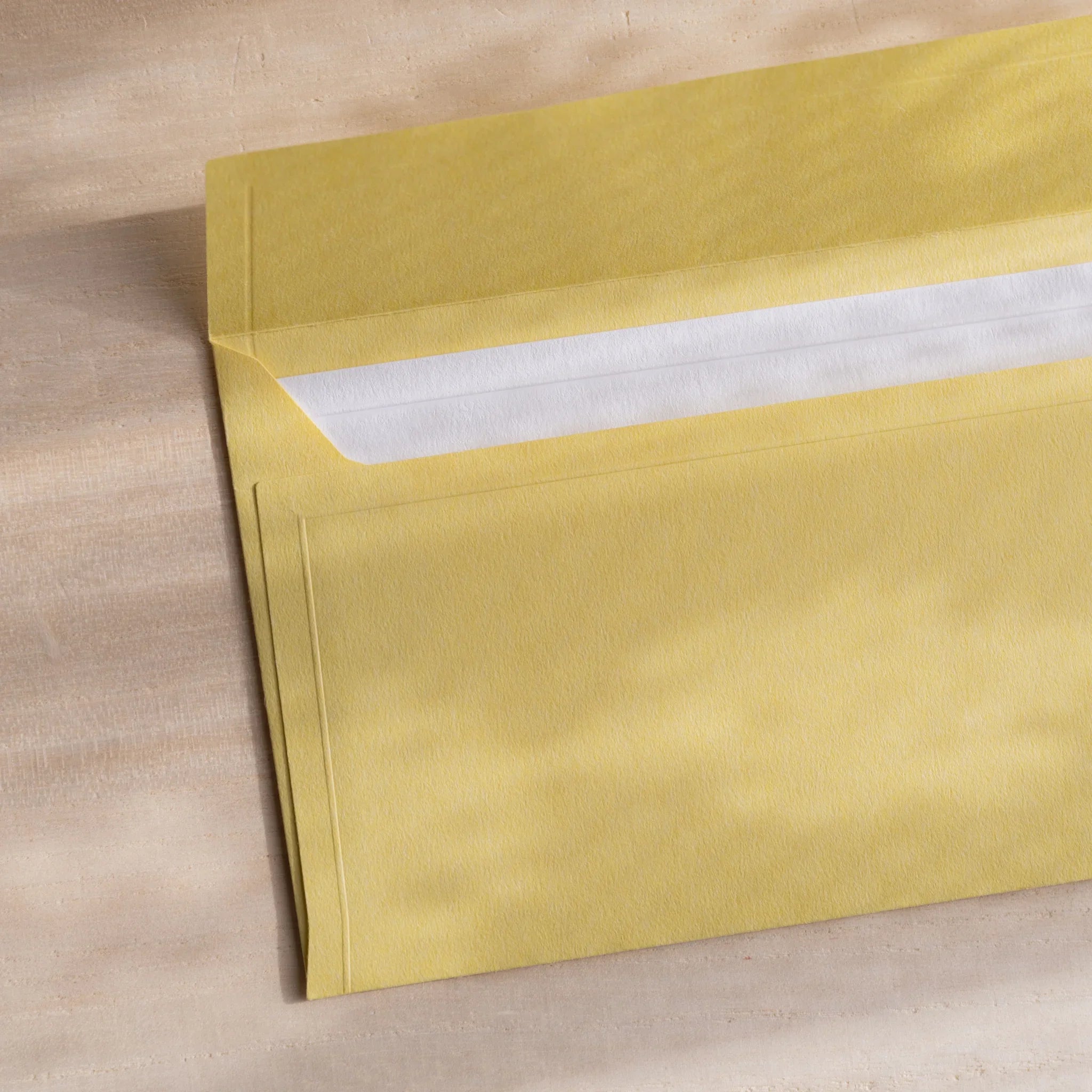 Dressco ivory medium embossed envelope image thirty-two, back view showing flap closure, with embossed pattern, set of three