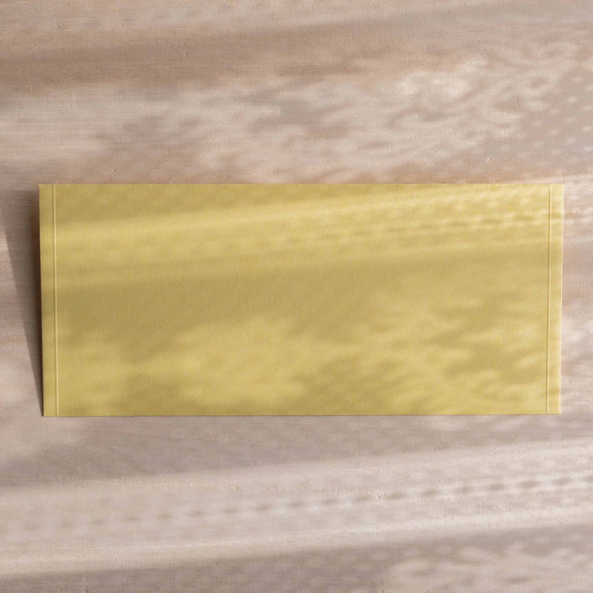 Dressco ivory medium embossed envelope image thirty-three, left angled side view, with embossed finish, set of three