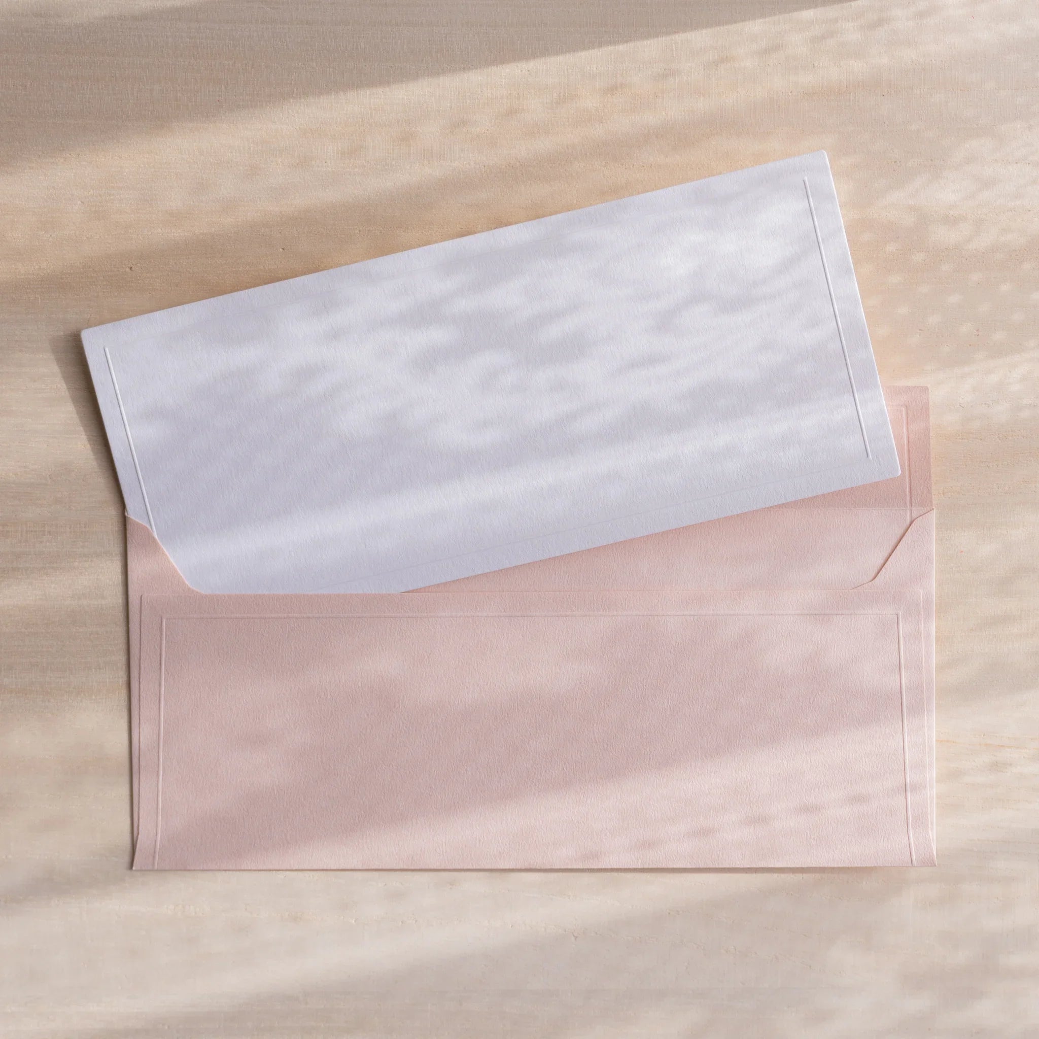 Dressco ivory medium embossed envelope image thirty-nine, fanned display layout, with embossed paper, set of three