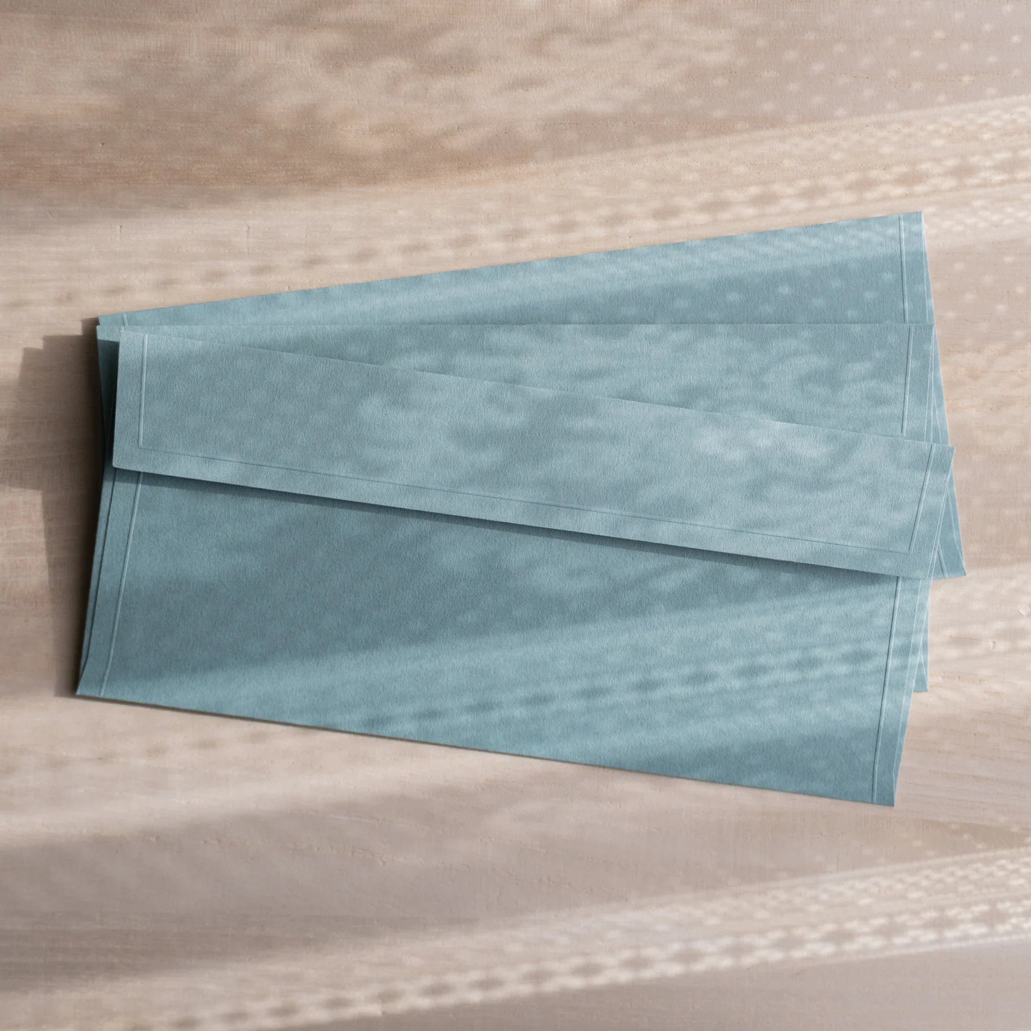 Dressco ivory medium embossed envelope image four, right angled side view, with embossing detail, set of three