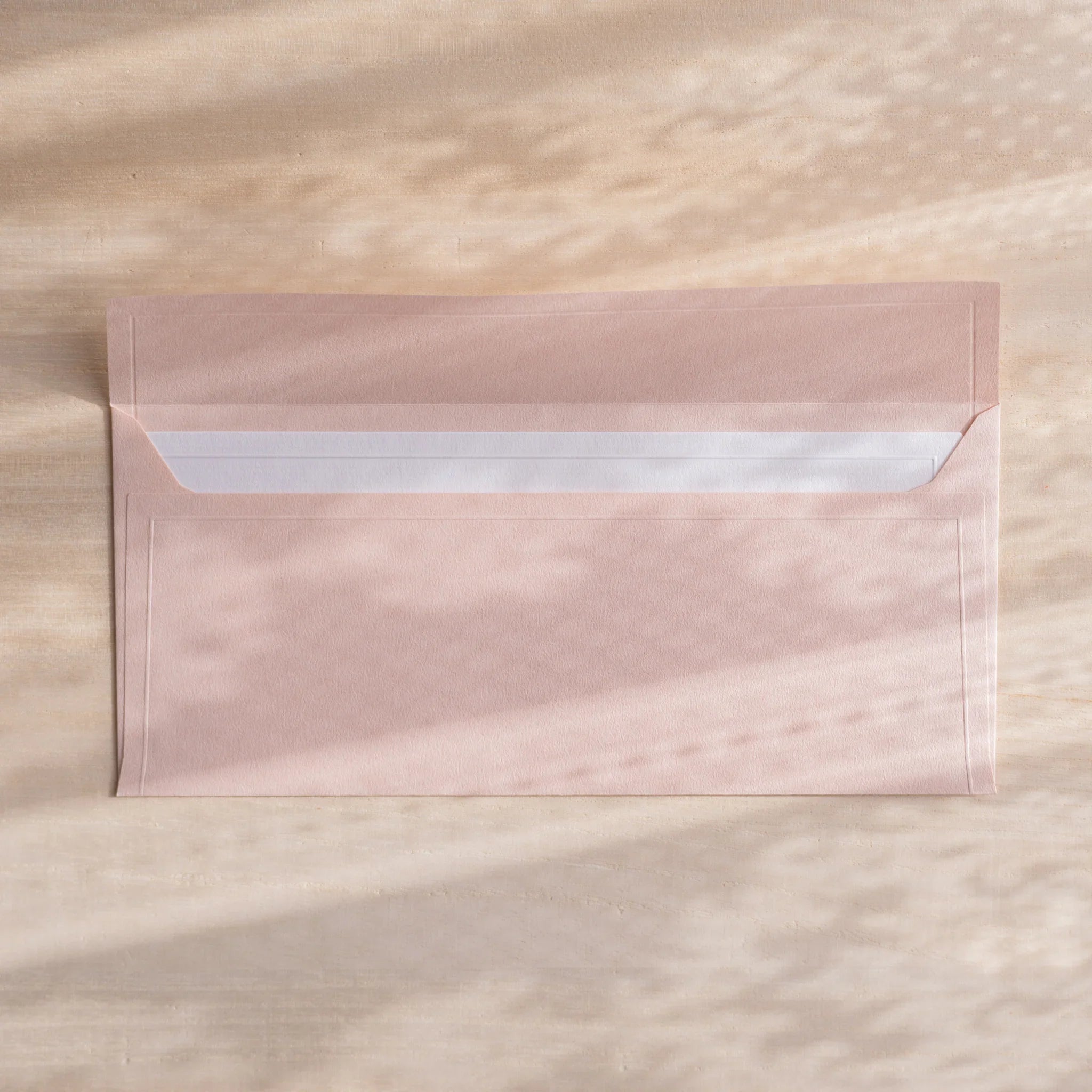 Dressco ivory medium embossed envelope image forty, stacked arrangement view, with embossing elegance, set of three