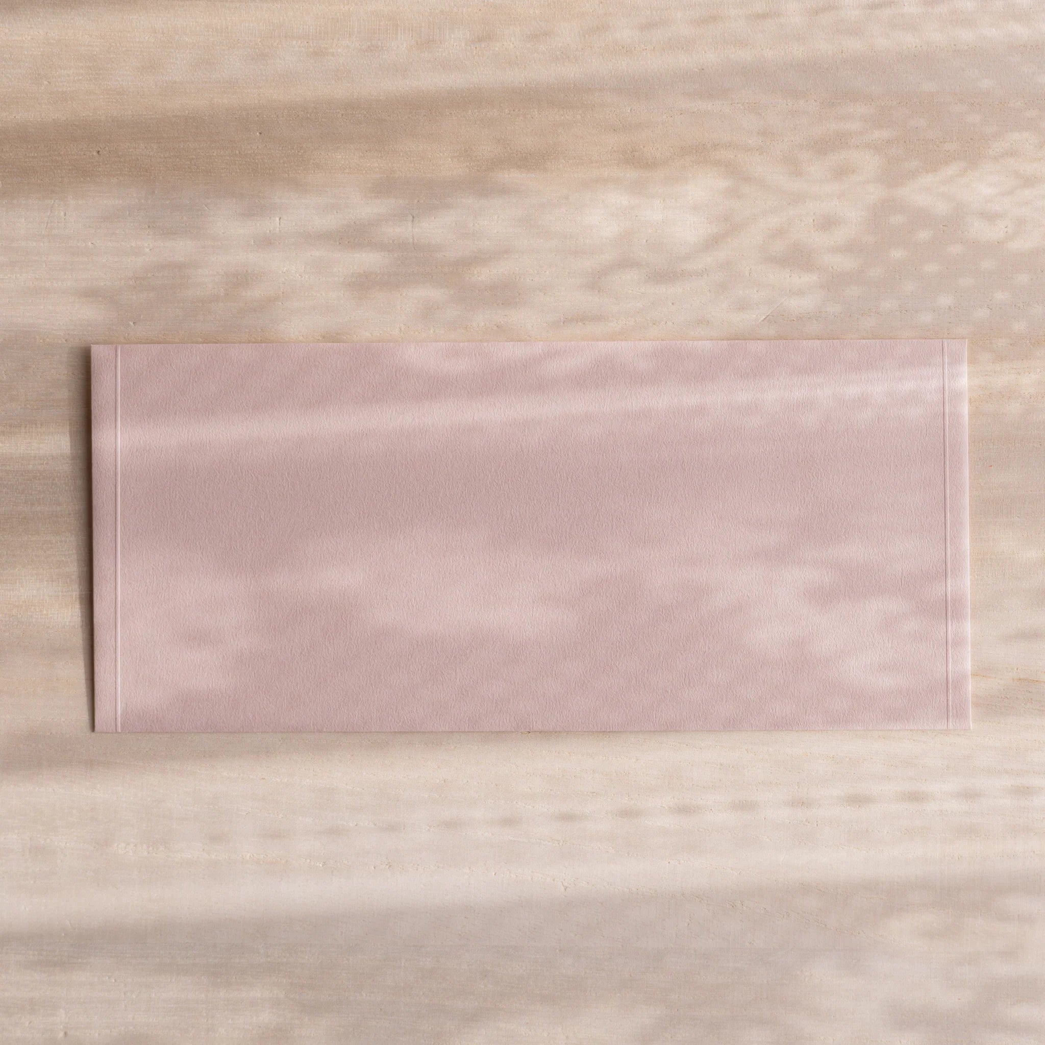 Dressco ivory medium embossed envelope image forty-two, back view showing flap closure, with embossed pattern, set of three