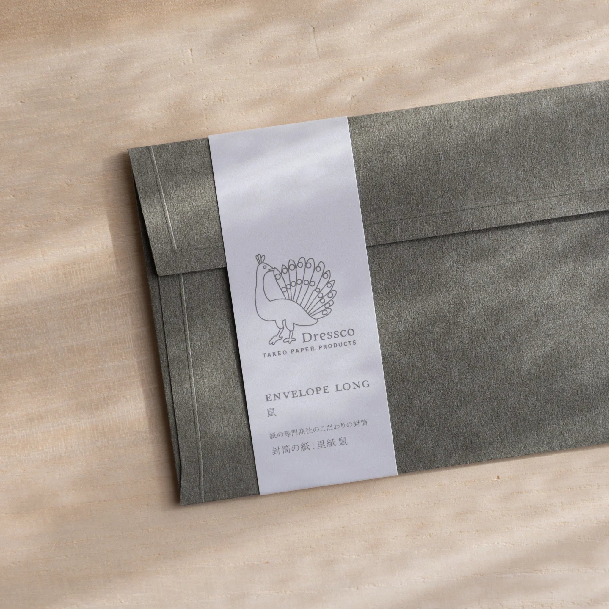 Dressco ivory medium embossed envelope image forty-five, overhead flat composition, with embossed surface, set of three