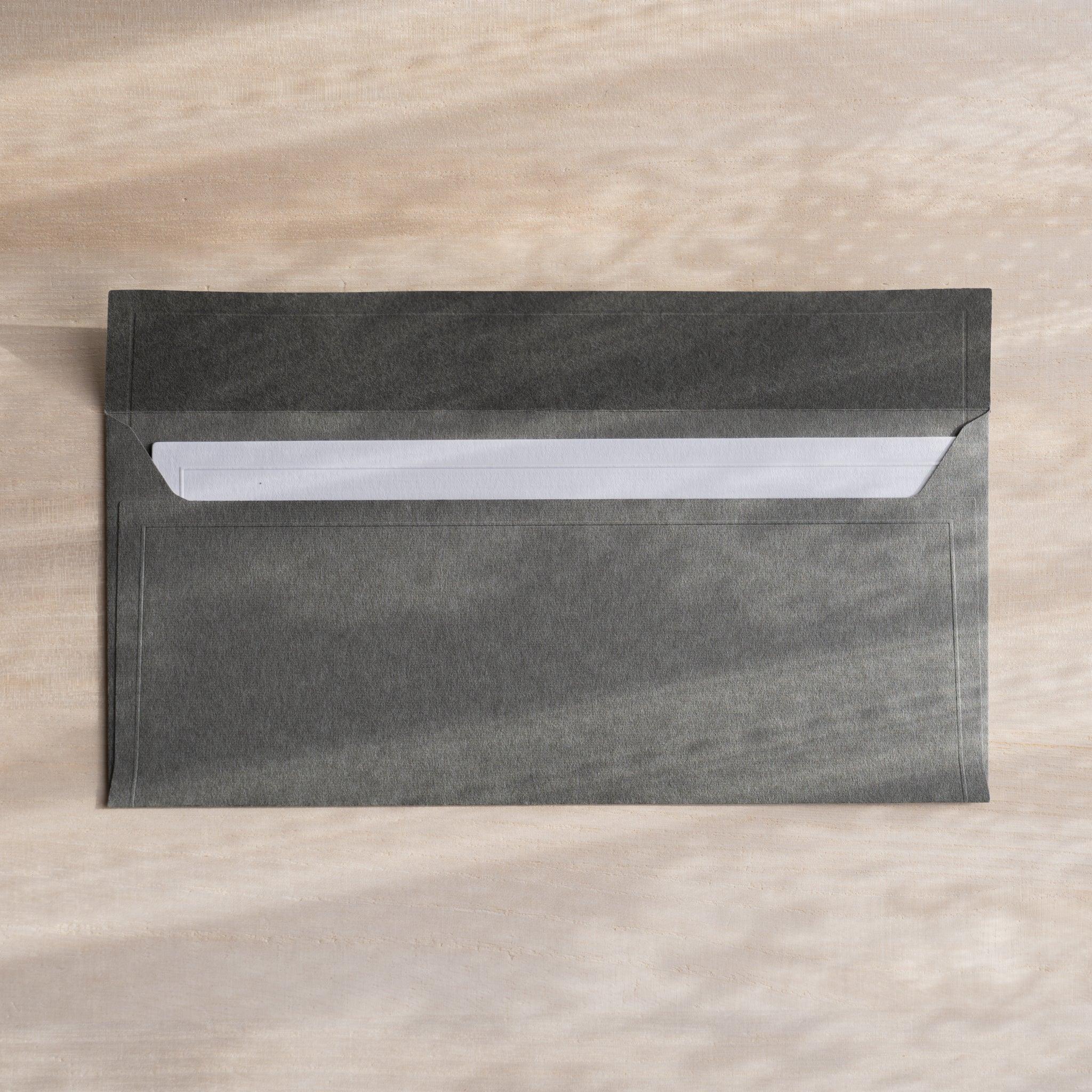 Dressco ivory medium embossed envelope image forty-nine, fanned display layout, with embossed paper, set of three