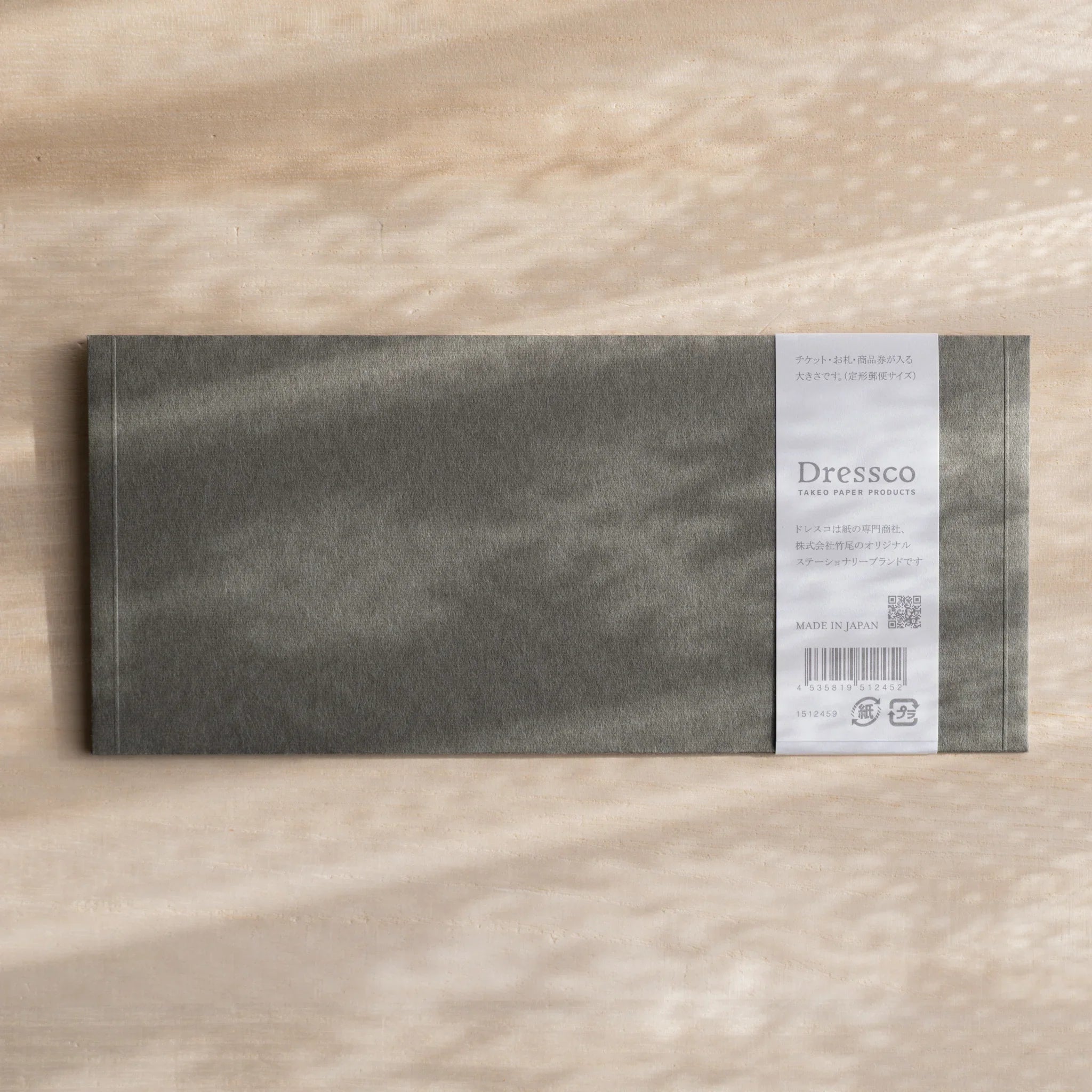 Dressco ivory medium embossed envelope image fifty-one, front view showing sealed flap, with raised embossing, set of three