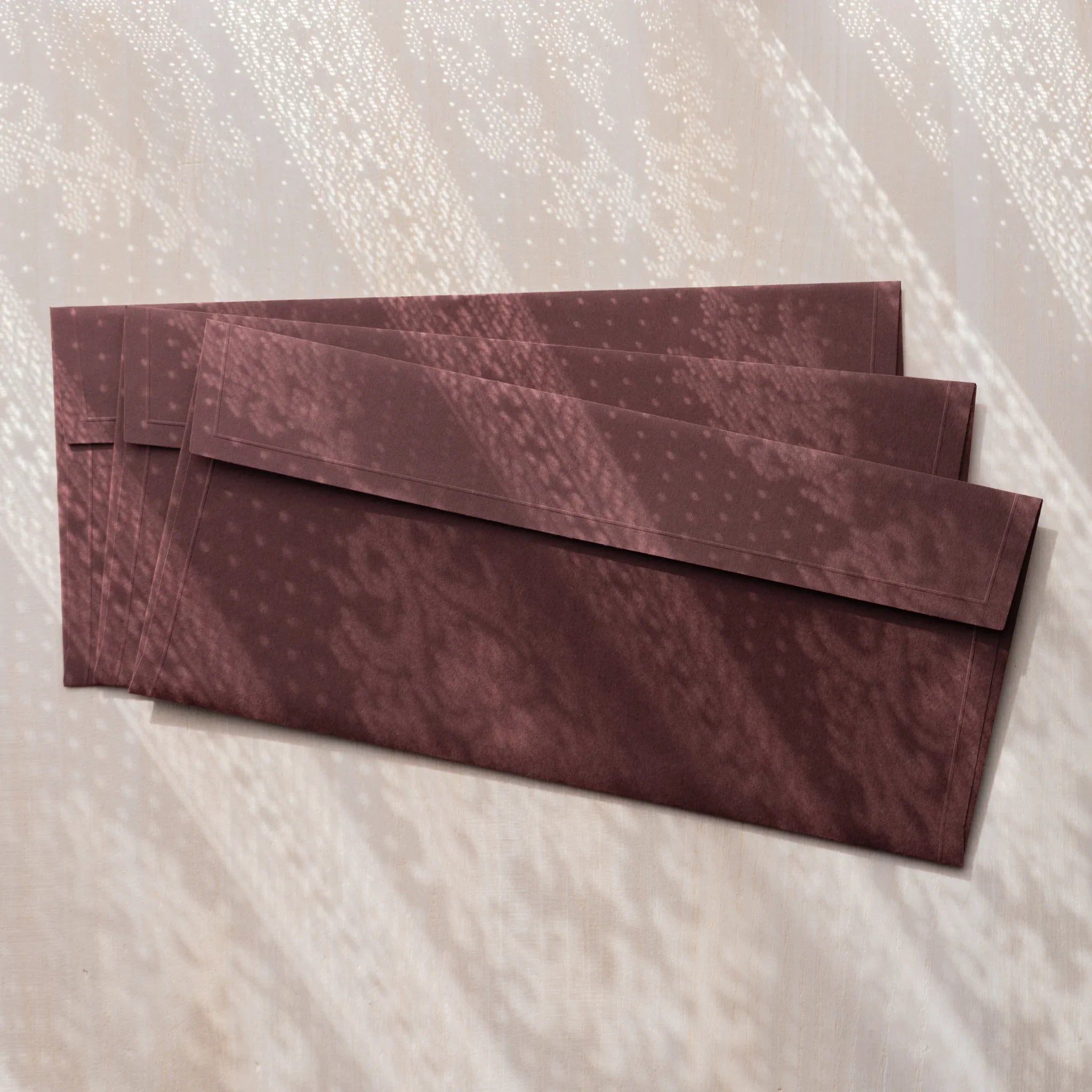 Dressco ivory medium embossed envelope image fifty-three, left angled side view, with embossed finish, set of three