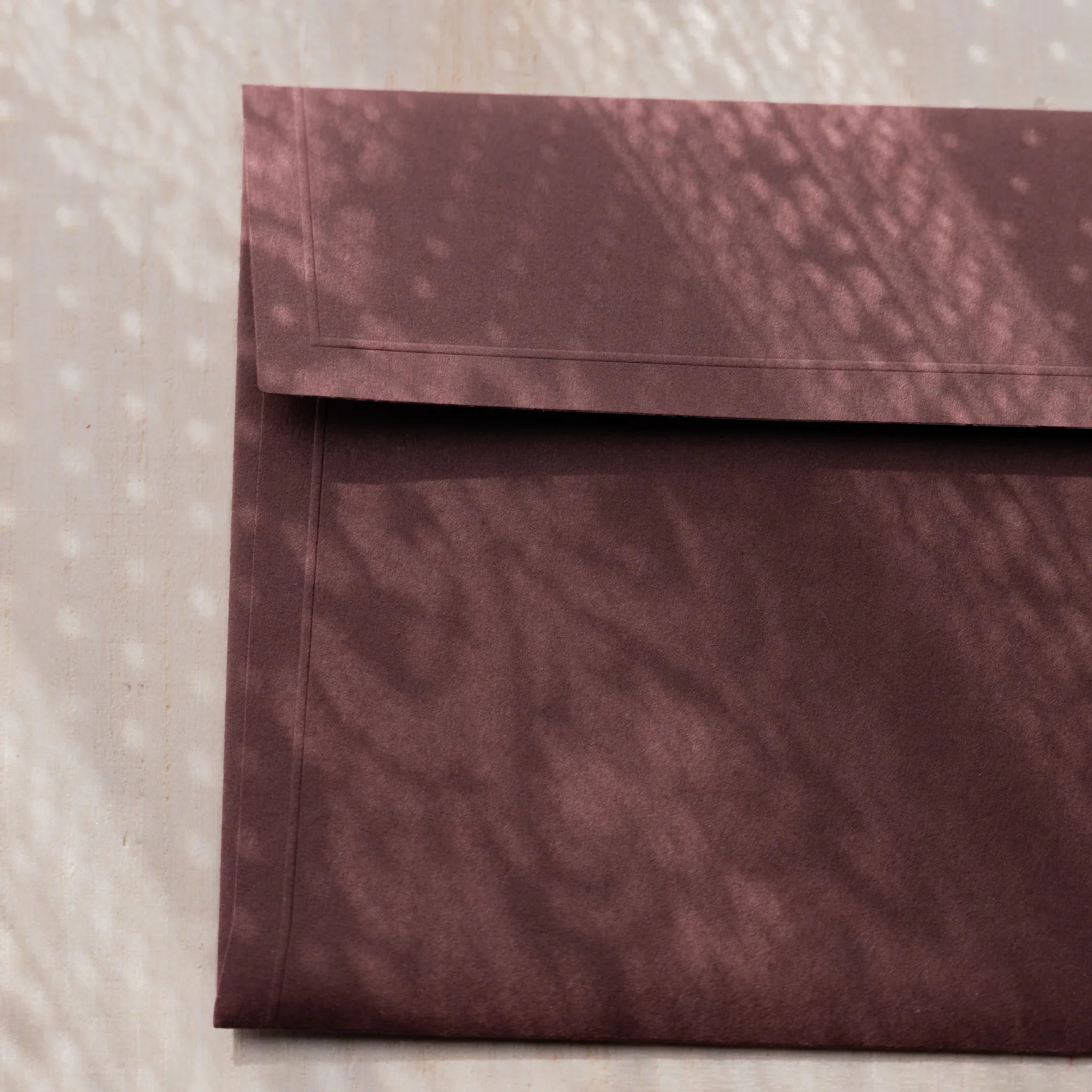 Dressco ivory medium embossed envelope image fifty-five, overhead flat composition, with embossed surface, set of three