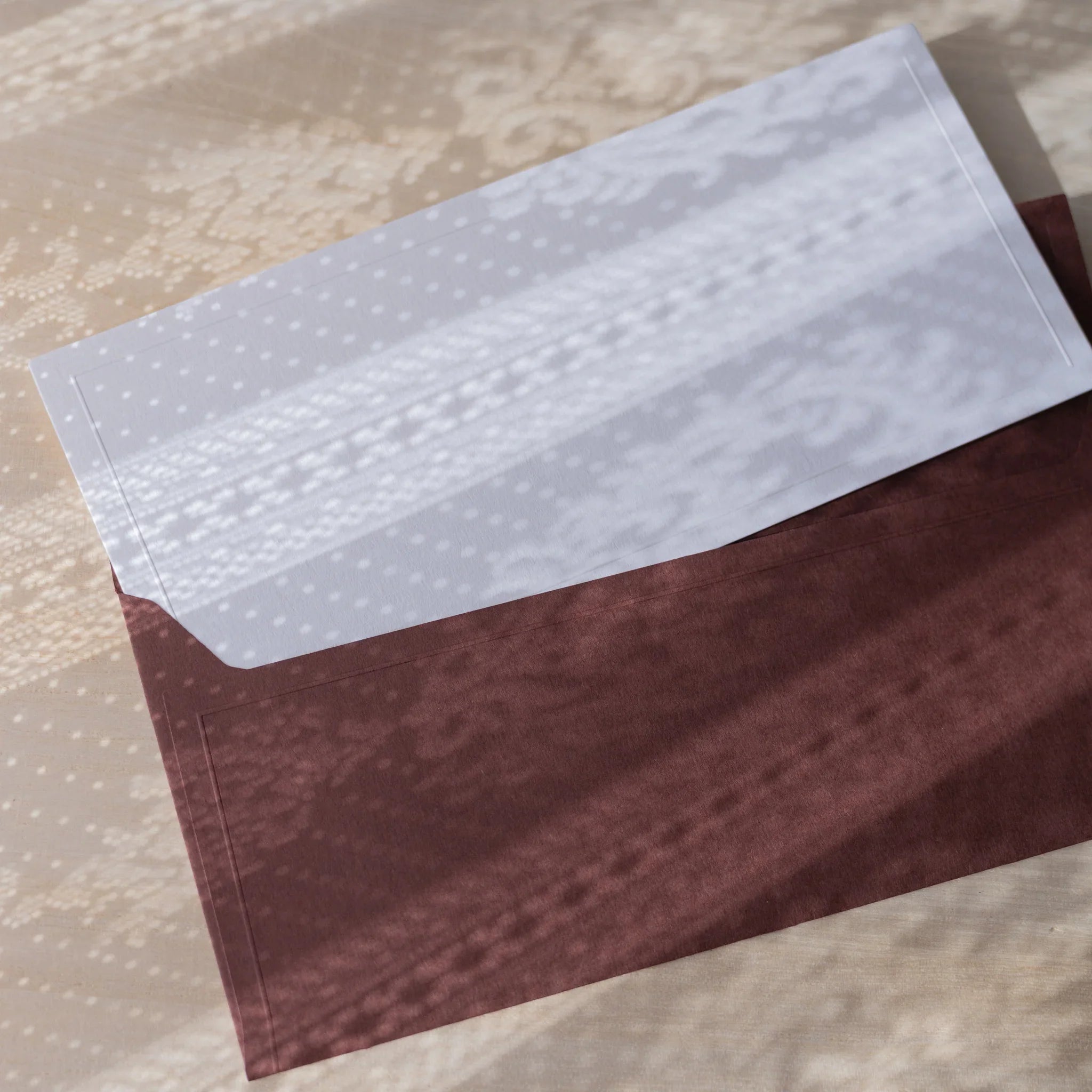 Dressco ivory medium embossed envelope image fifty-eight, corner detail view, with embossing design, set of three