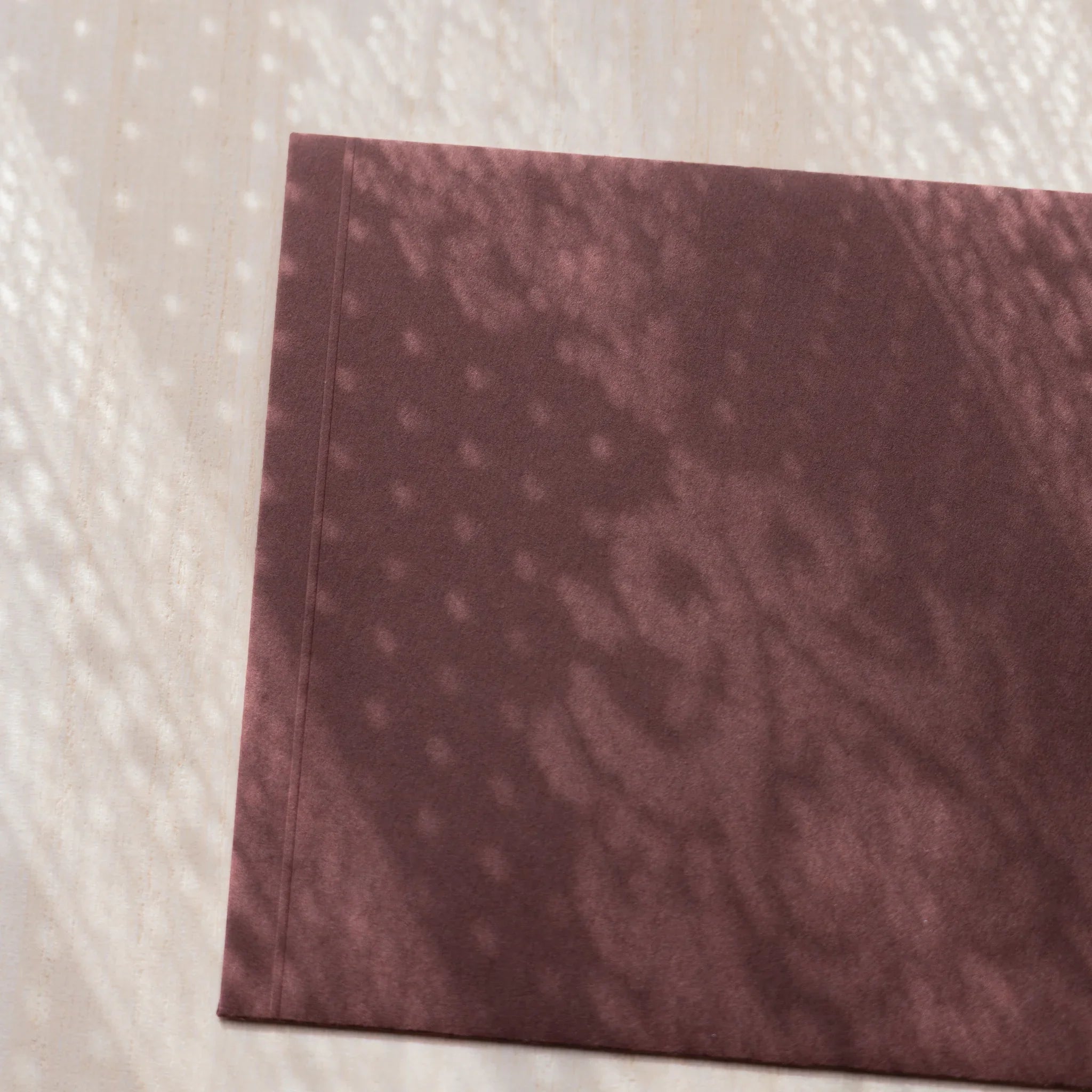 Dressco ivory medium embossed envelope image sixty-one, front view showing sealed flap, with raised embossing, set of three