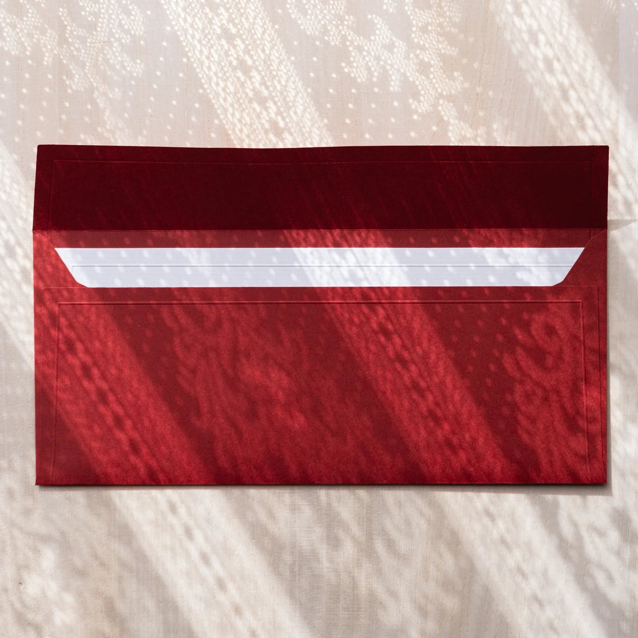 Dressco ivory medium embossed envelope image sixty-nine, fanned display layout, with embossed paper, set of three