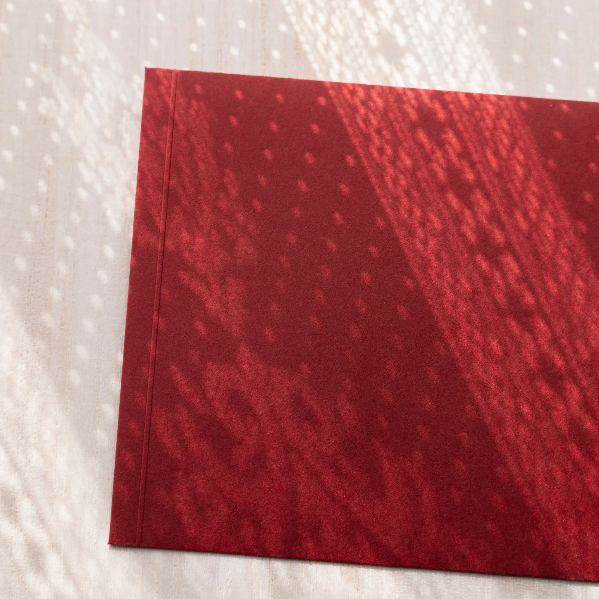 Dressco ivory medium embossed envelope image seventy-one, front view showing sealed flap, with raised embossing, set of three