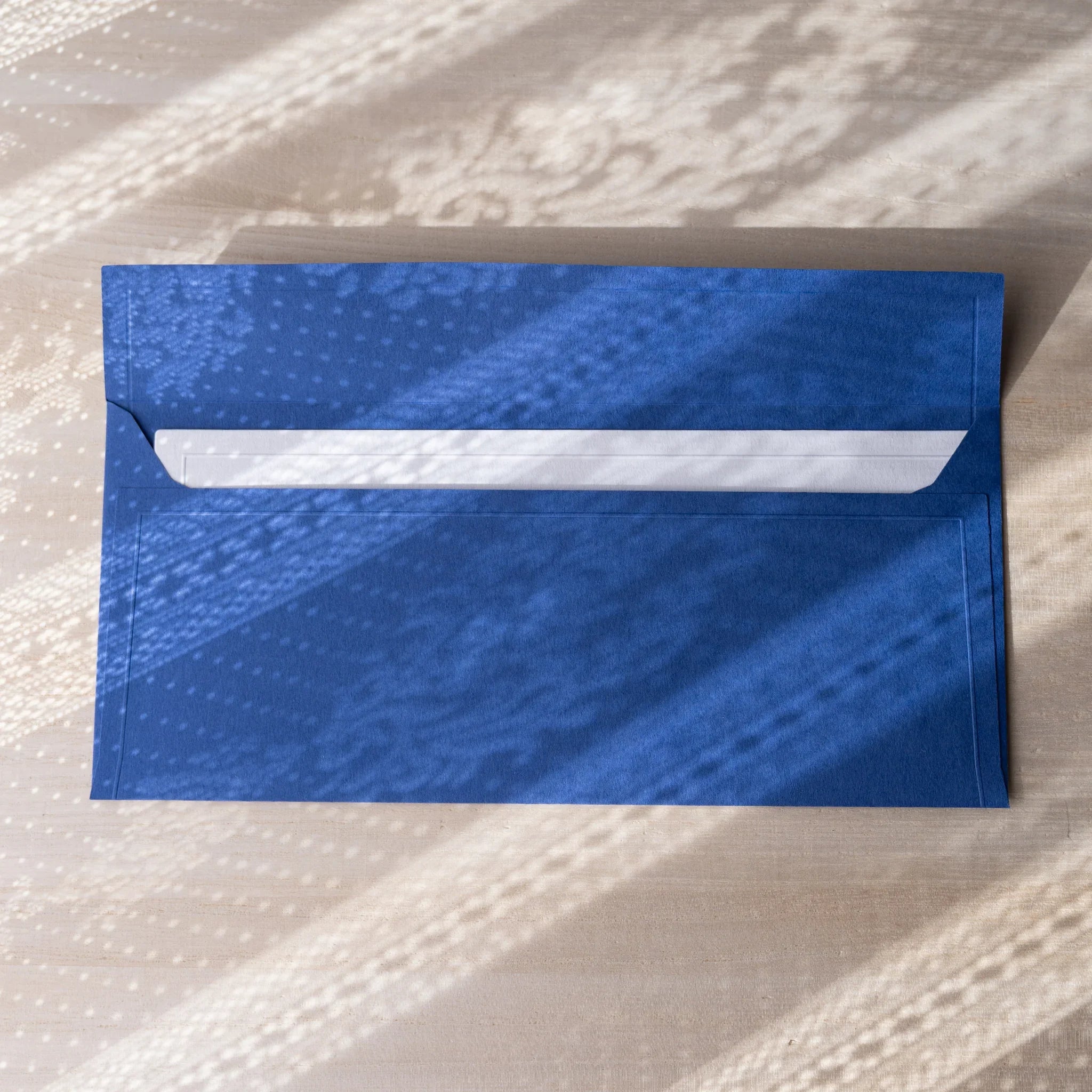 Dressco ivory medium embossed envelope image eighty, stacked arrangement view, with embossing elegance, set of three