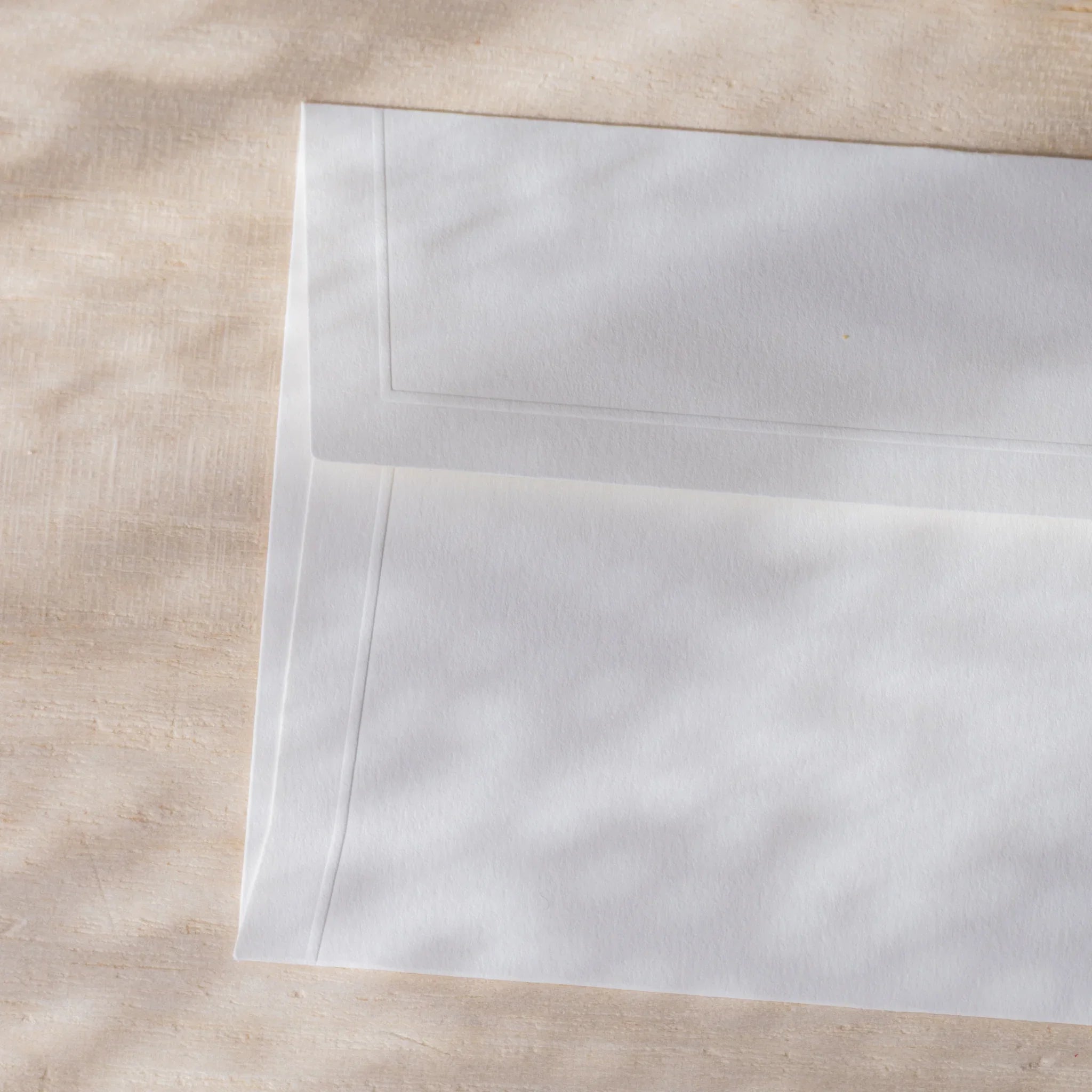 Dressco small embossed envelope set, yellow shade, fanned arrangement with subtl