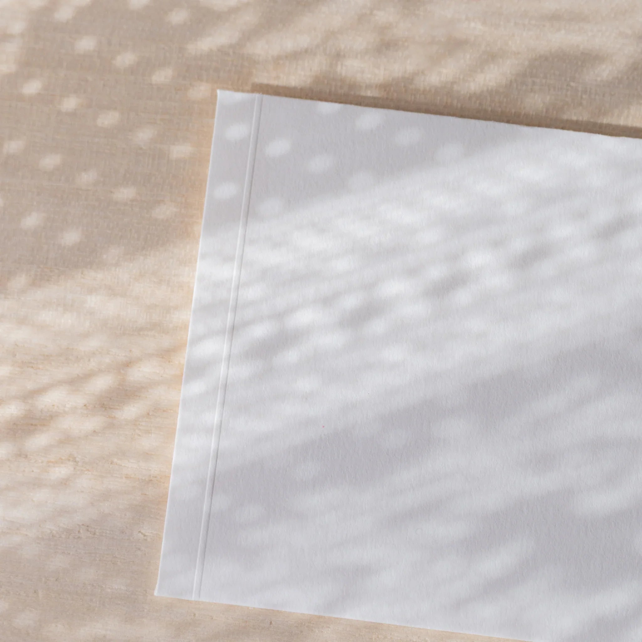 Dressco envelope collection featuring white, angled display highlighting embosse