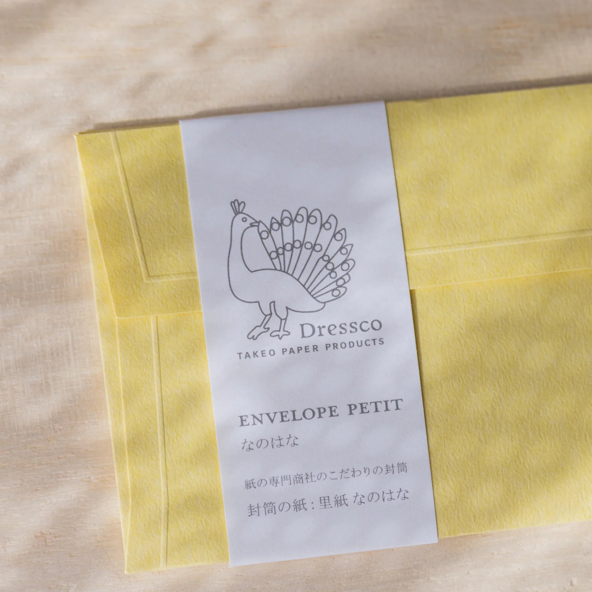 Dressco envelope collection featuring yellow, arranged display highlighting rais