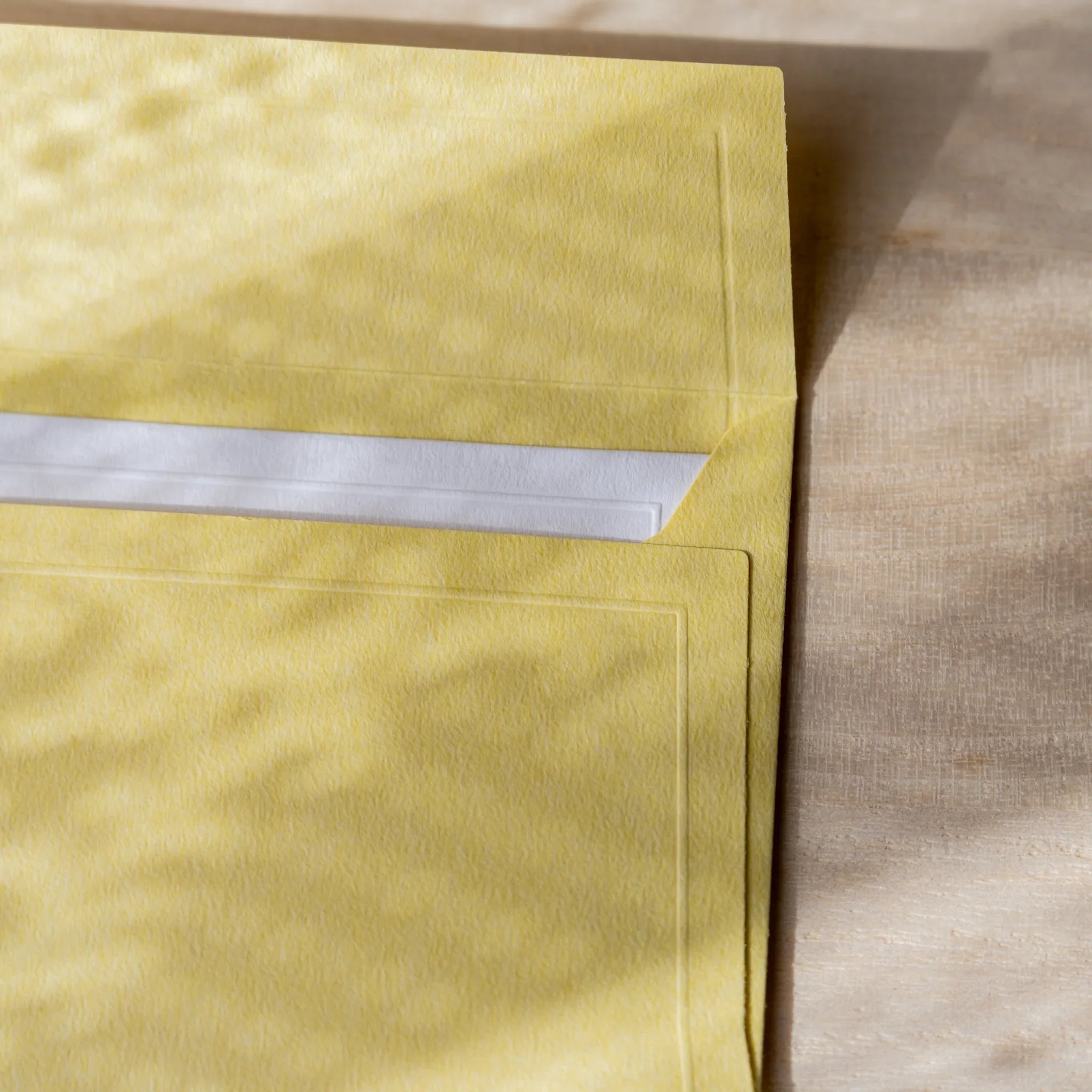 Dressco envelope collection featuring white, angled display highlighting decorat