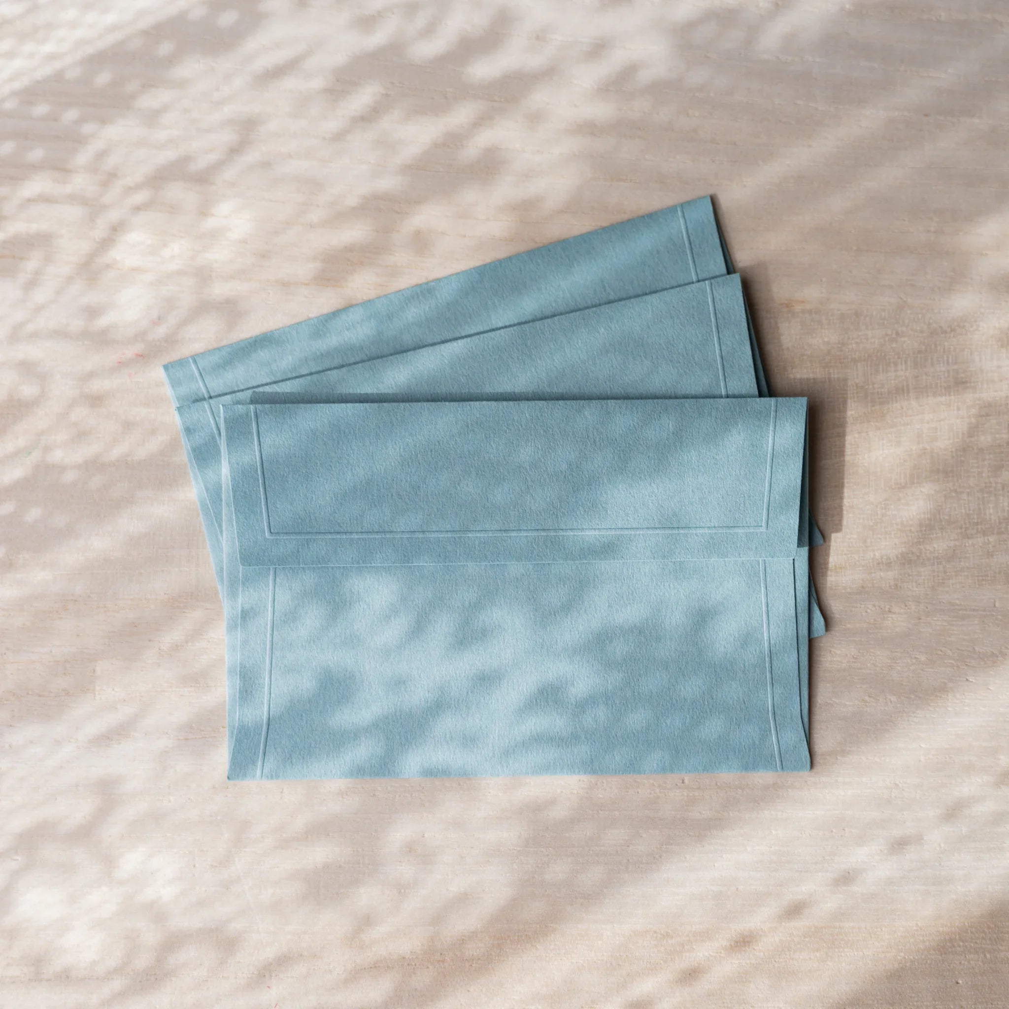 Dressco small embossed envelope set, yellow shade, fanned arrangement with textu