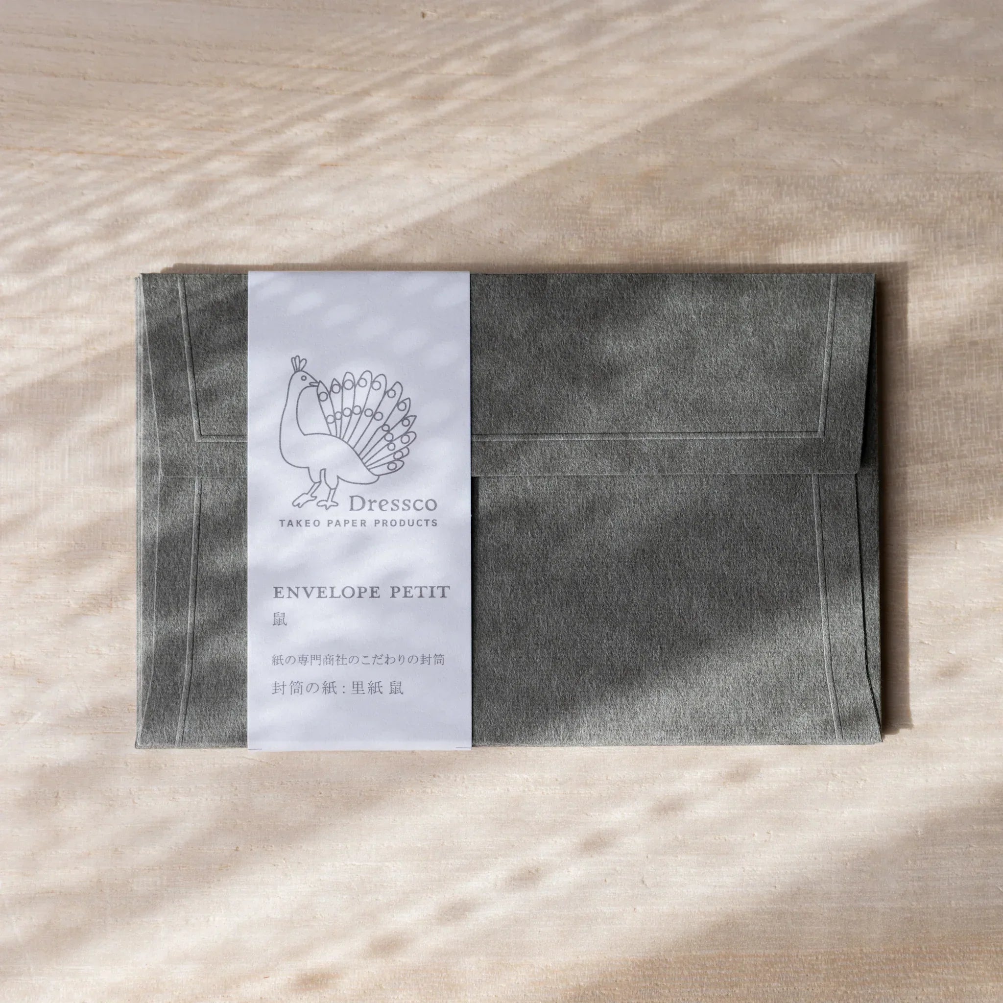Dressco envelope featuring soft toned, side view highlighting surface texture
